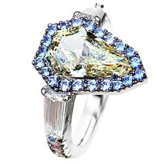 1.43 Carat VVS2 GIA Fancy Yellow Shield Cut Diamond, Unheated Blue Sapphire Ring