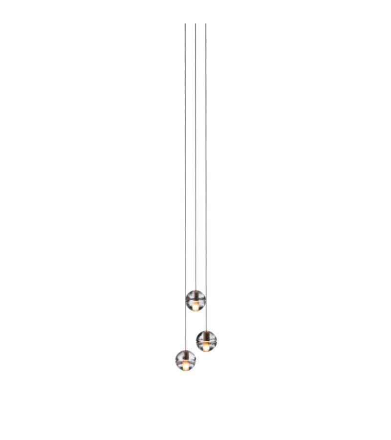 14.3 Chandelier lamp by Bocci
Dimensions: diameter 15.2 x height 300 cm 
Materials: Cast glass, blown borosilicate glass, braided metal coaxial cable, electrical components, white powder-coated canopy.
Available in deep, shallow, or mini canopy.