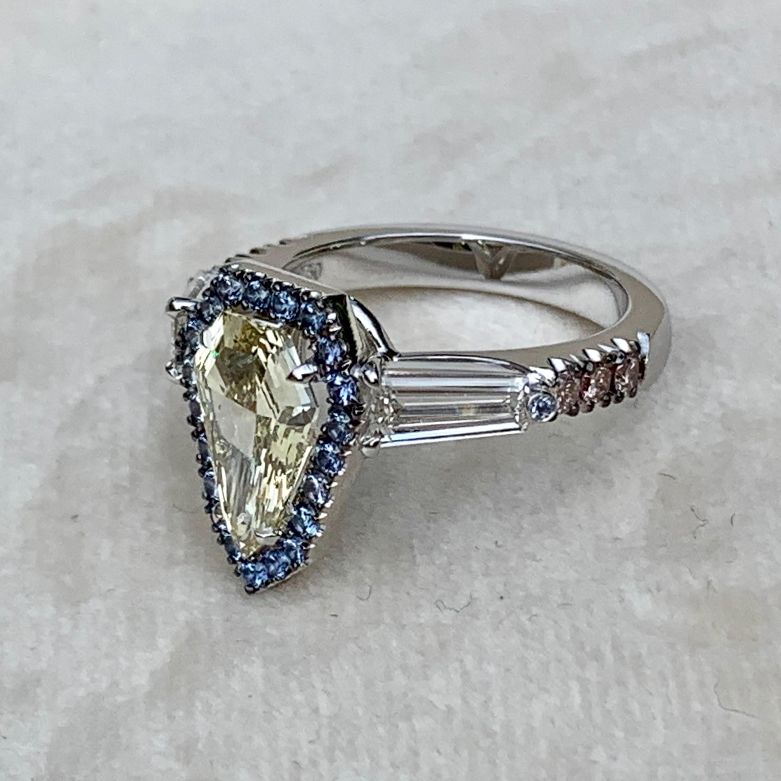 Contemporary 1.43 Carat VVS2 GIA Fancy Yellow Shield Cut Diamond, Unheated Blue Sapphire Ring