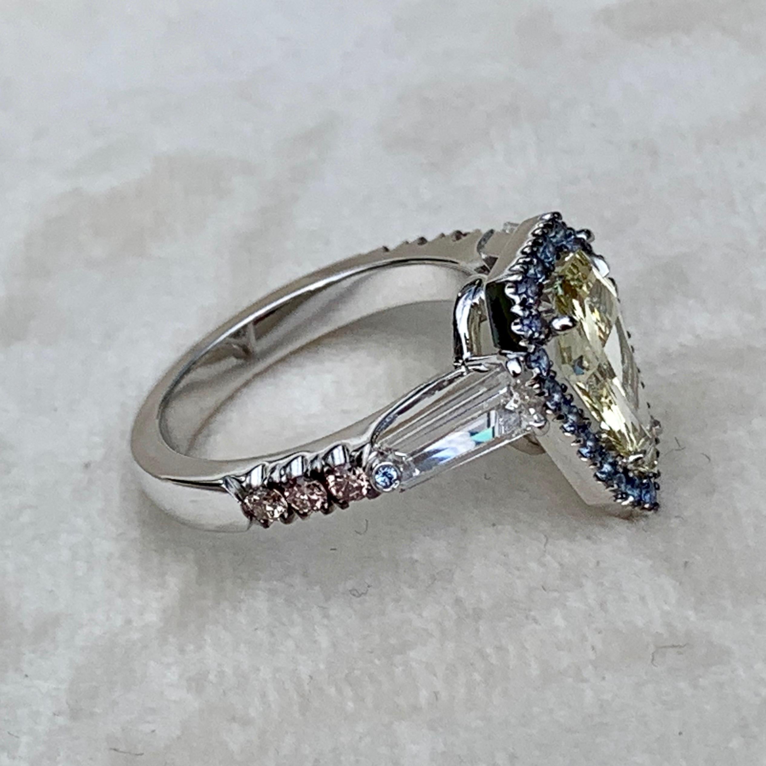 1.43 Ct. VVS2 GIA Fancy Yellow Shield Cut Diamond, Unheated Blue Sapphire Ring 1