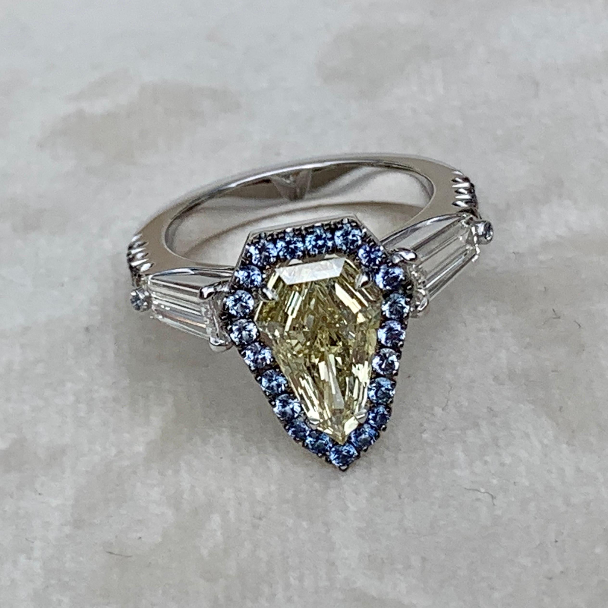 1.43 Ct. VVS2 GIA Fancy Yellow Shield Cut Diamond, Unheated Blue Sapphire Ring 2