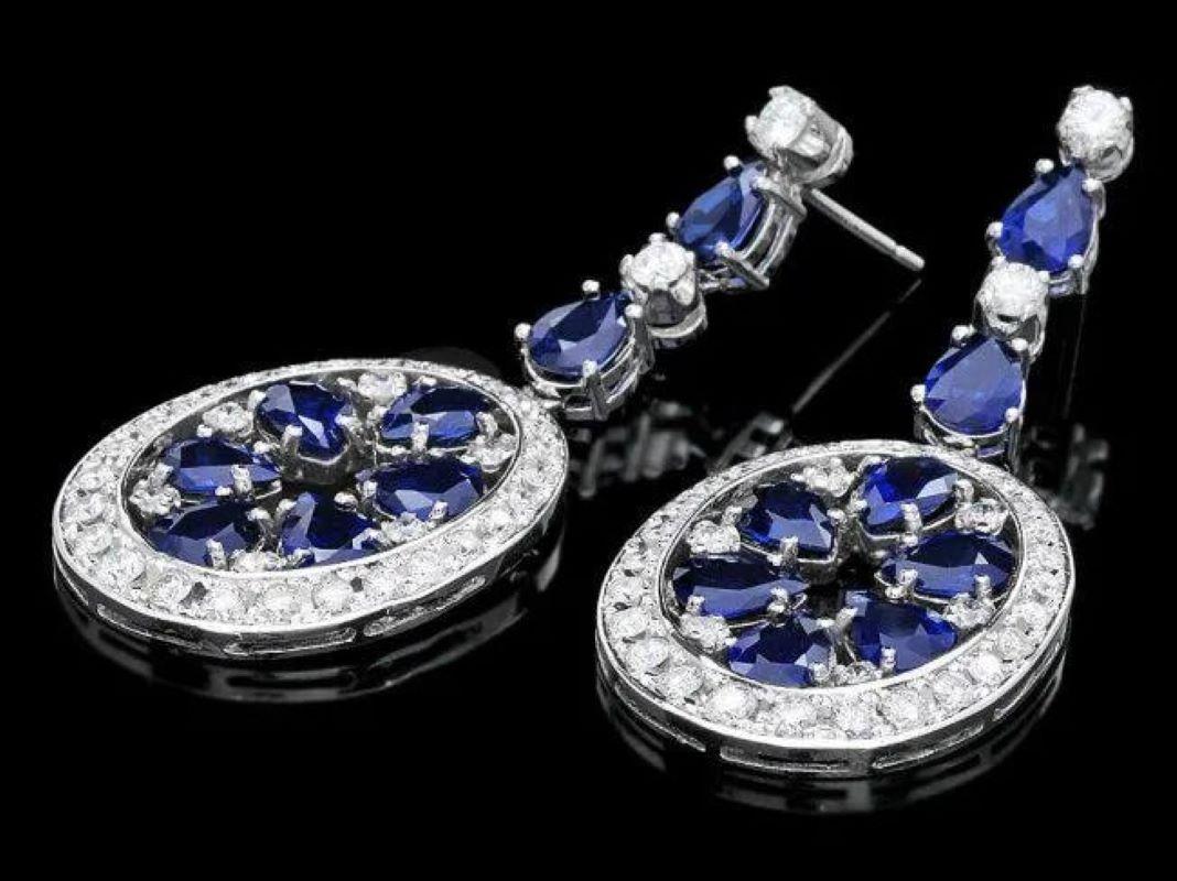14.30 Carats Natural Sapphire and Diamond 14K Solid White Gold Earrings

Total Natural Sapphire Weight: Approx. 11.40 Carats

Sapphire Treatment: Diffusion

Sapphire Measure: Approx. 5 x 7 mm

Total Natural Round Diamonds Weight: Approx. 2.90 Carats