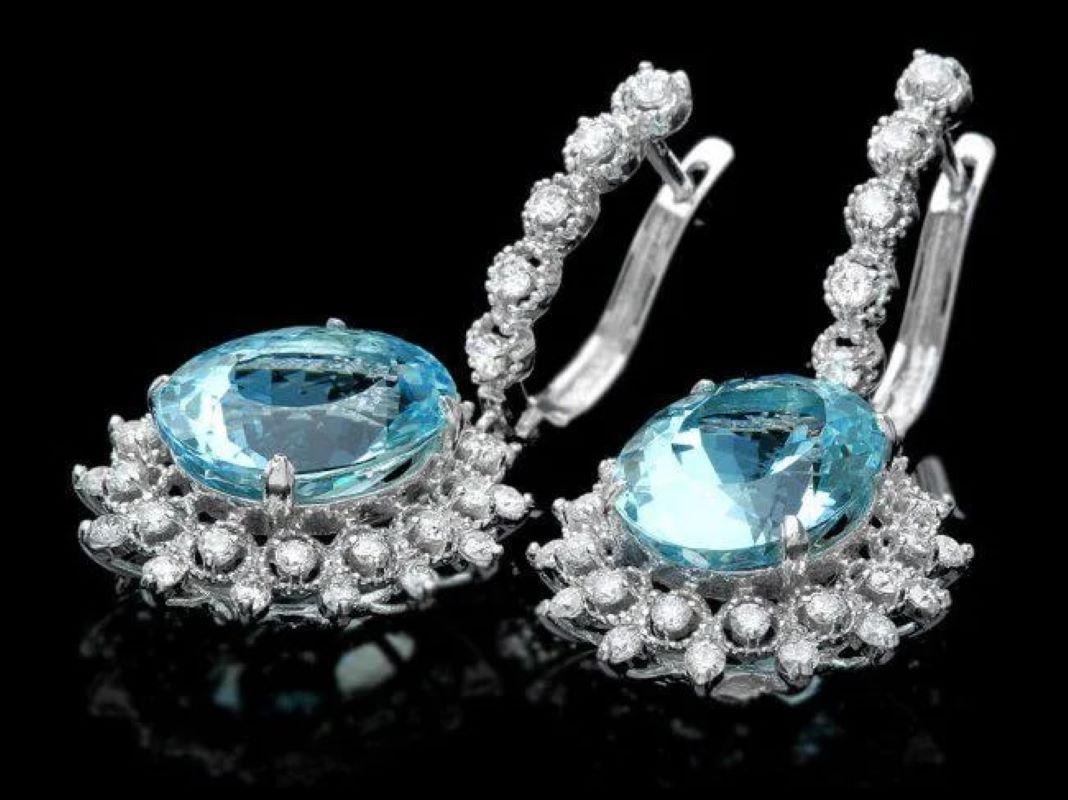14.30Ct Natural Aquamarine and Diamond 14K Solid White Gold Earrings

Total Natural Oval Blue Aquamarines Weight is: 12.90 Carats

Aquamarine Measure: 14 x 11 mm

Total Natural Diamonds Weight: 1.40 Carats (color G-H / Clarity SI1-SI2)

Total