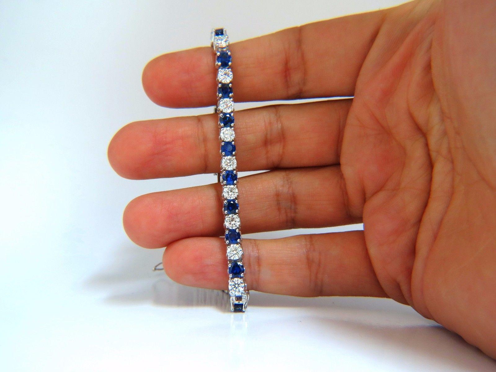 Calibrated Royal Blues.

8.11ct. Natural Blue Sapphires

 & 6.24ct Diamonds bracelet.

Full Round cuts, great sparkle.

Average Each: 4.25mm diameter

Clean Clarity & Transparent.

Vivid Blues and Prime Saturation.

Round Brilliant Diamonds: G-color