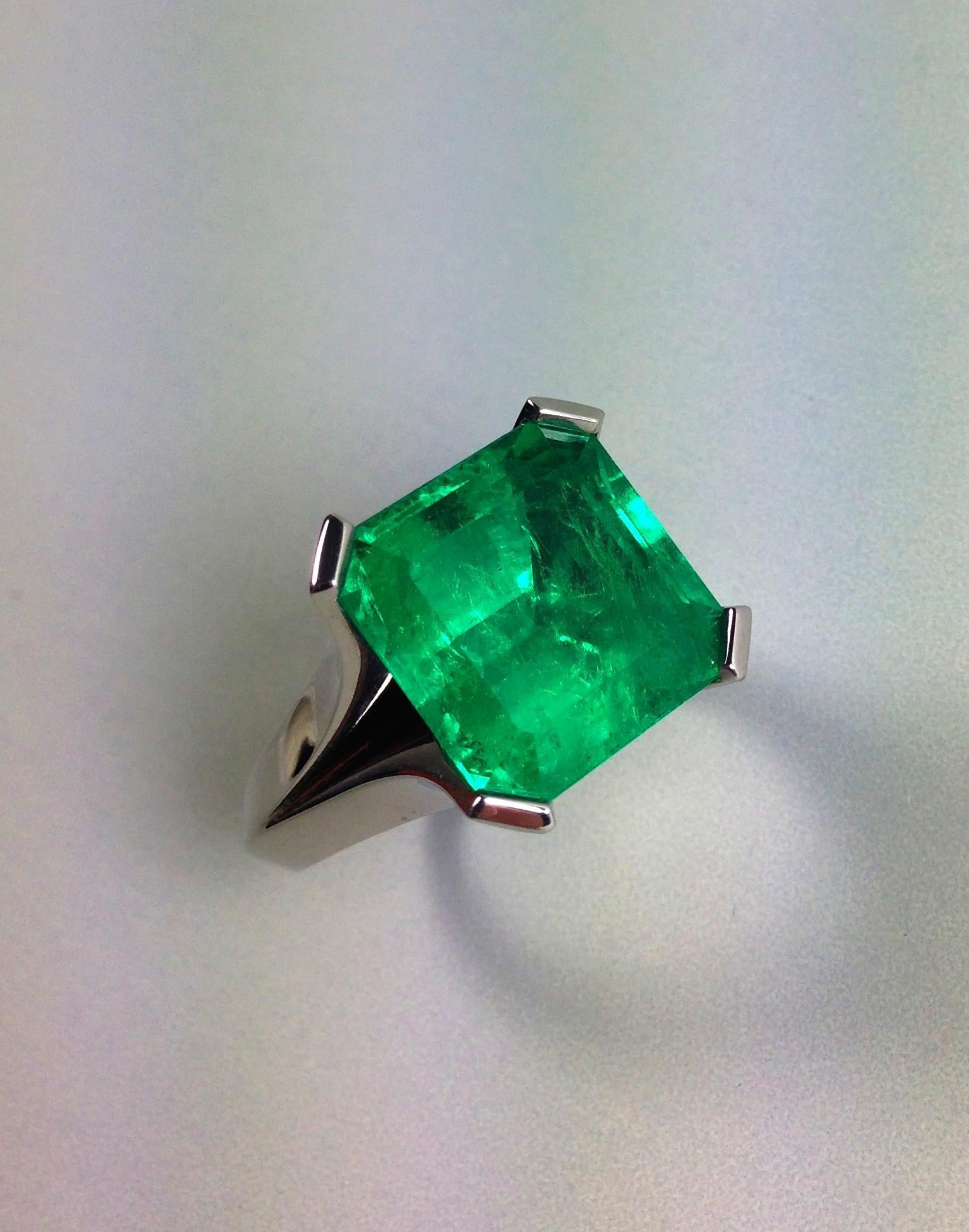 EVERY0NE'S DARLING is my name. Stylish Colombian emerald solitaire cocktail ring, designed based on a Cartier study of the 1930 years, handcrafted in solid 18 karat white gold with fluid like prongs by Trusted Green. Showcasing a top class quality