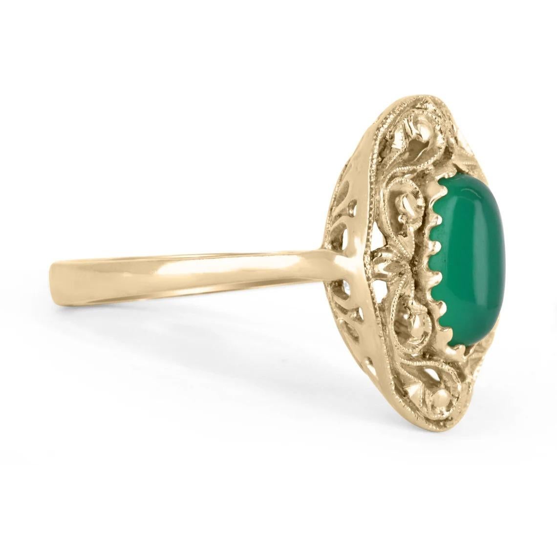 Featured is this exquisite emerald cabochon solitaire handcrafted and carved ring in 18K solid gold. The rare beautiful center stone has a full 2.03-carats of a natural emerald cabochon with a dark yellowish-green color. This elongated stone is