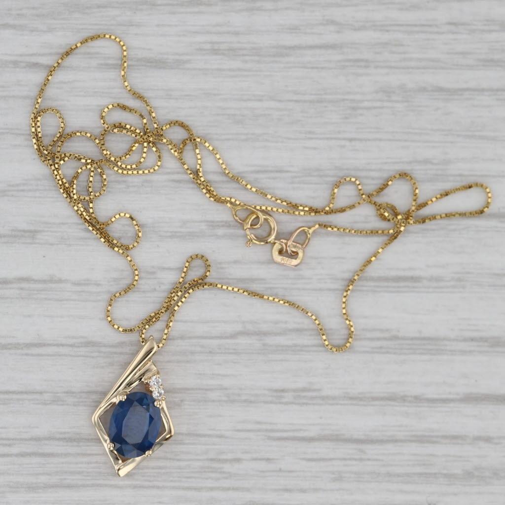 Gemstone Information:
- Natural Diamonds -
Total Carats - 0.03ctw
Cut - Round Brilliant
Color - G - H
Clarity - VS2 - SI1

- Natural Sapphire -
Carat - 1.40ct
Cut - Oval Brilliant
Color - Dark Blue
Treatment - Heated

Metal: 14k Yellow Gold
Weight: