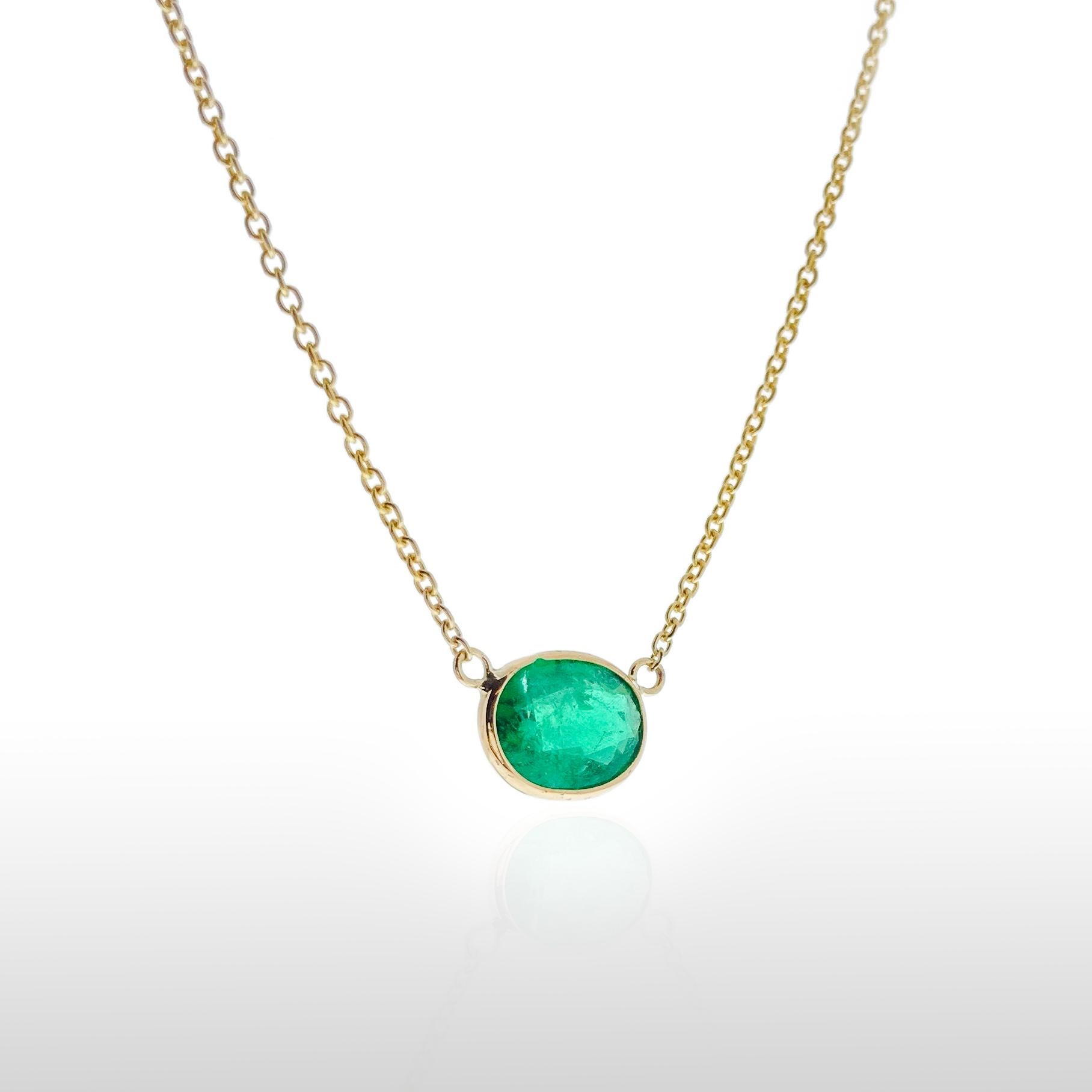 This necklace features an oval-cut green emerald with a weight of 1.44 carats, set in 14k yellow gold (YG). Emeralds are well-known for their rich green color, and the oval cut is a classic and timeless choice for gemstones, offering an elegant and