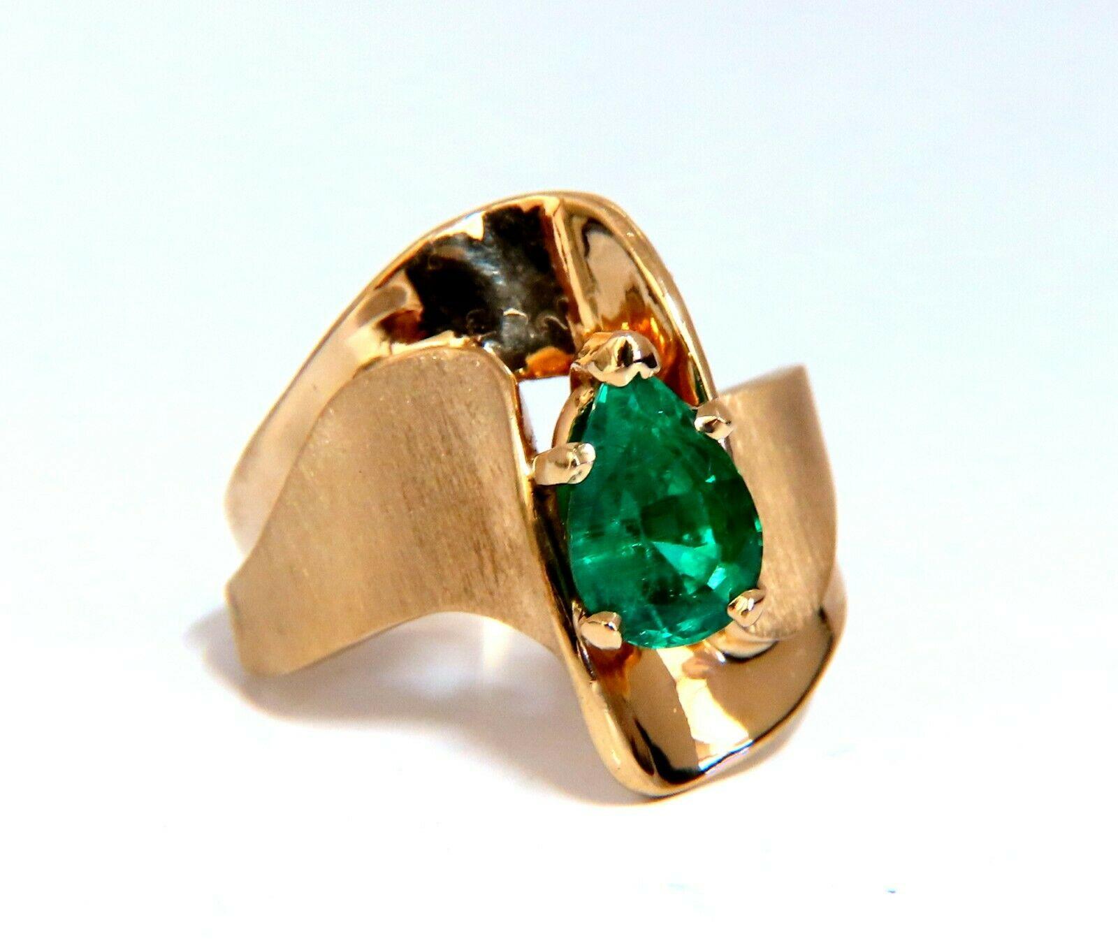 1.44 carat natural emerald ring.

Emerald clean clarity and transparent pear shape. Measures 8x6mm.

14 karat yelliw gold 6.9 grams

19 mm wide

depth 9mm

Size 8 and we may resize please inquire.