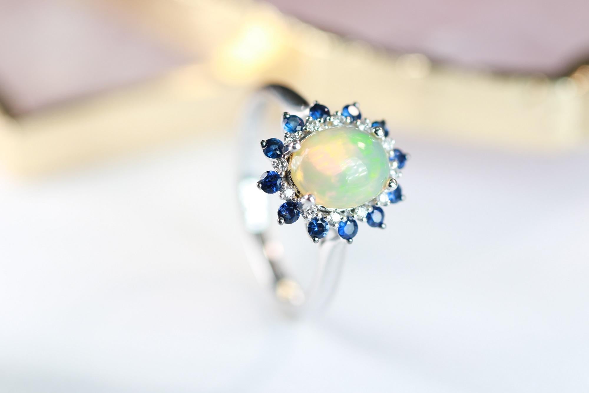 Art Deco 1.44 Carat Oval Cab Ethiopian Opal Blue Sapphire and Diamond 10K White Gold Ring For Sale