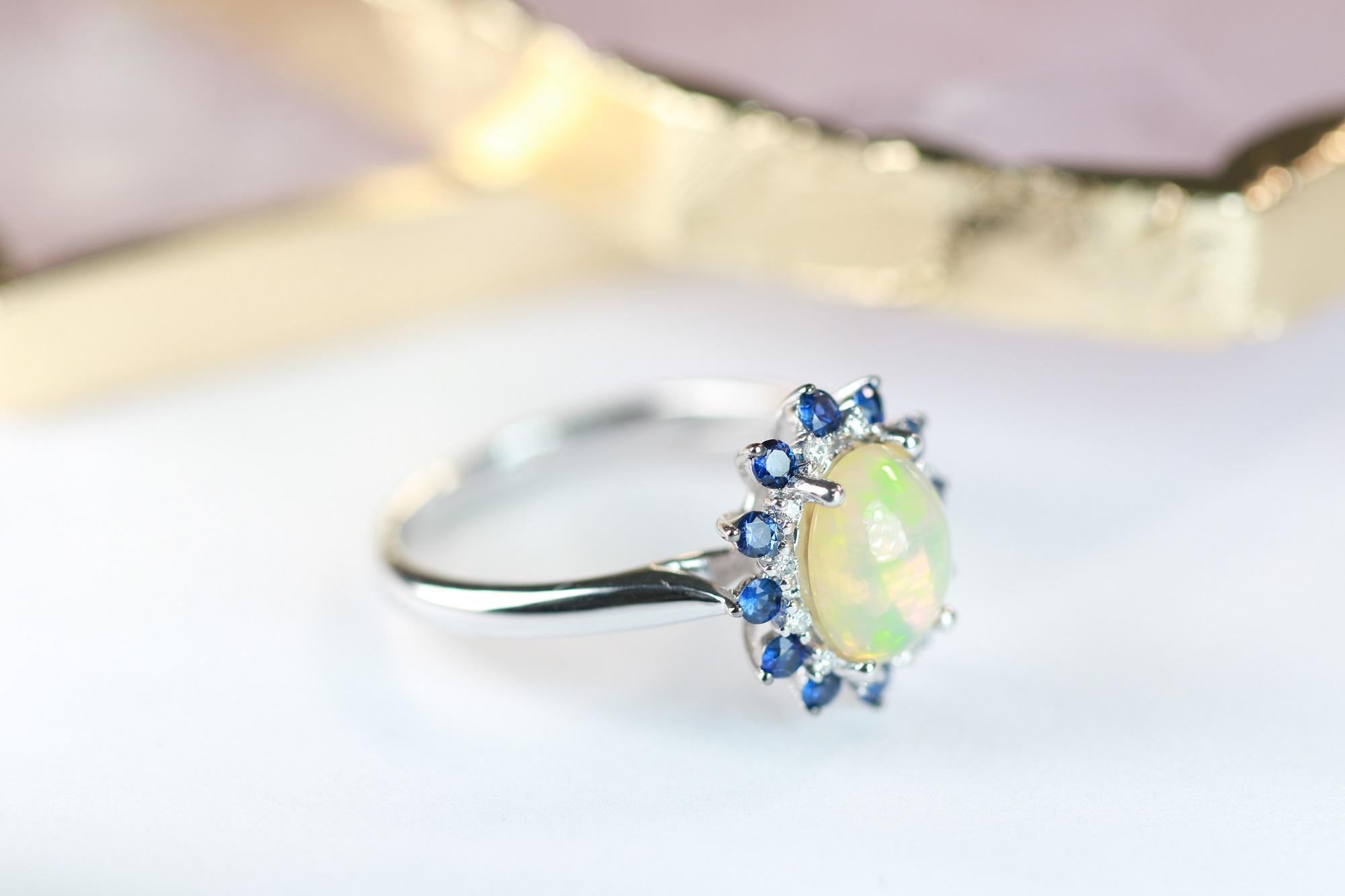 Oval Cut 1.44 Carat Oval Cab Ethiopian Opal Blue Sapphire and Diamond 10K White Gold Ring For Sale