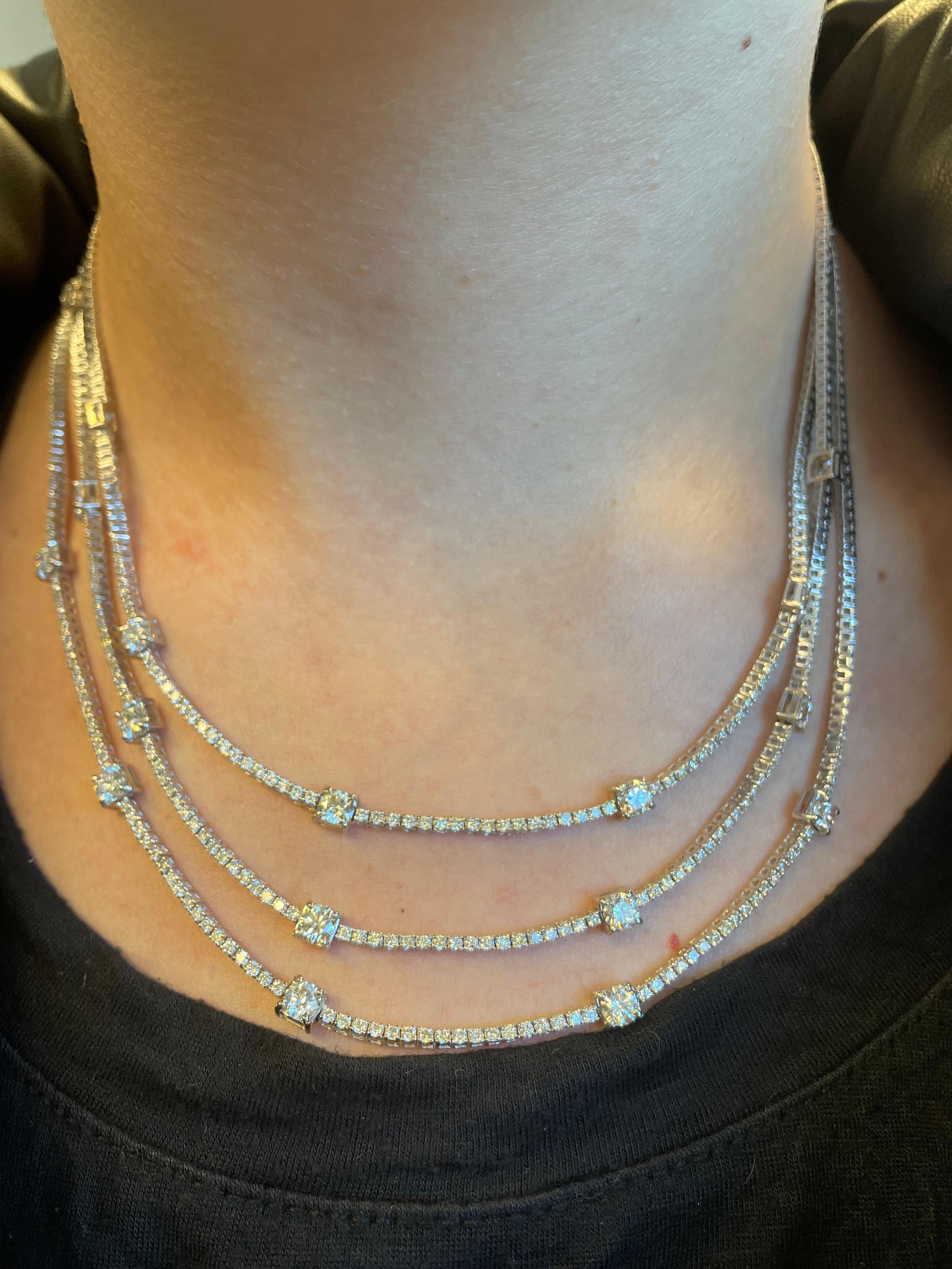 Sensational 3 row diamond tennis necklace. High jewelry by Alexander of Beverly Hills.
17 larger round brilliant diamonds, 5.65 carats. Along with 666 round brilliant diamonds, 8.75 carats. Approximately H/I color and SI clarity. 18k white gold.