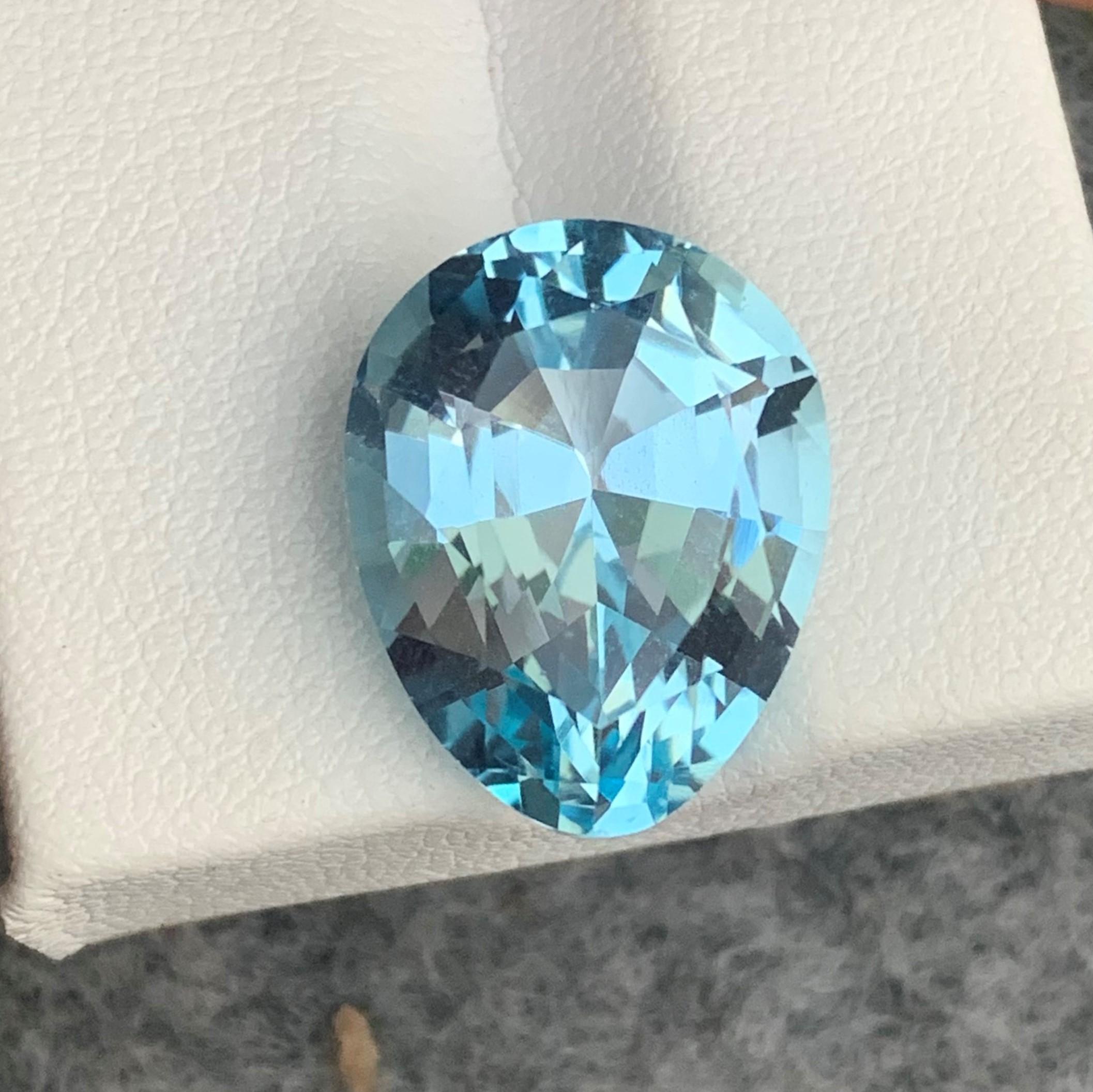 Faceted Sky Blue Topaz 
Weight : 14.40 Carats
Dimensions : 16.8x13.3x9.2 Mm
Origin : Brazil
Clarity : Eye Clean
Shape: Pear
Cut/Facet: Cushion Pear
Color: Light Blue
Certificate: On Demand
Blue Topaz Metaphysical Properties
Blue topaz, in