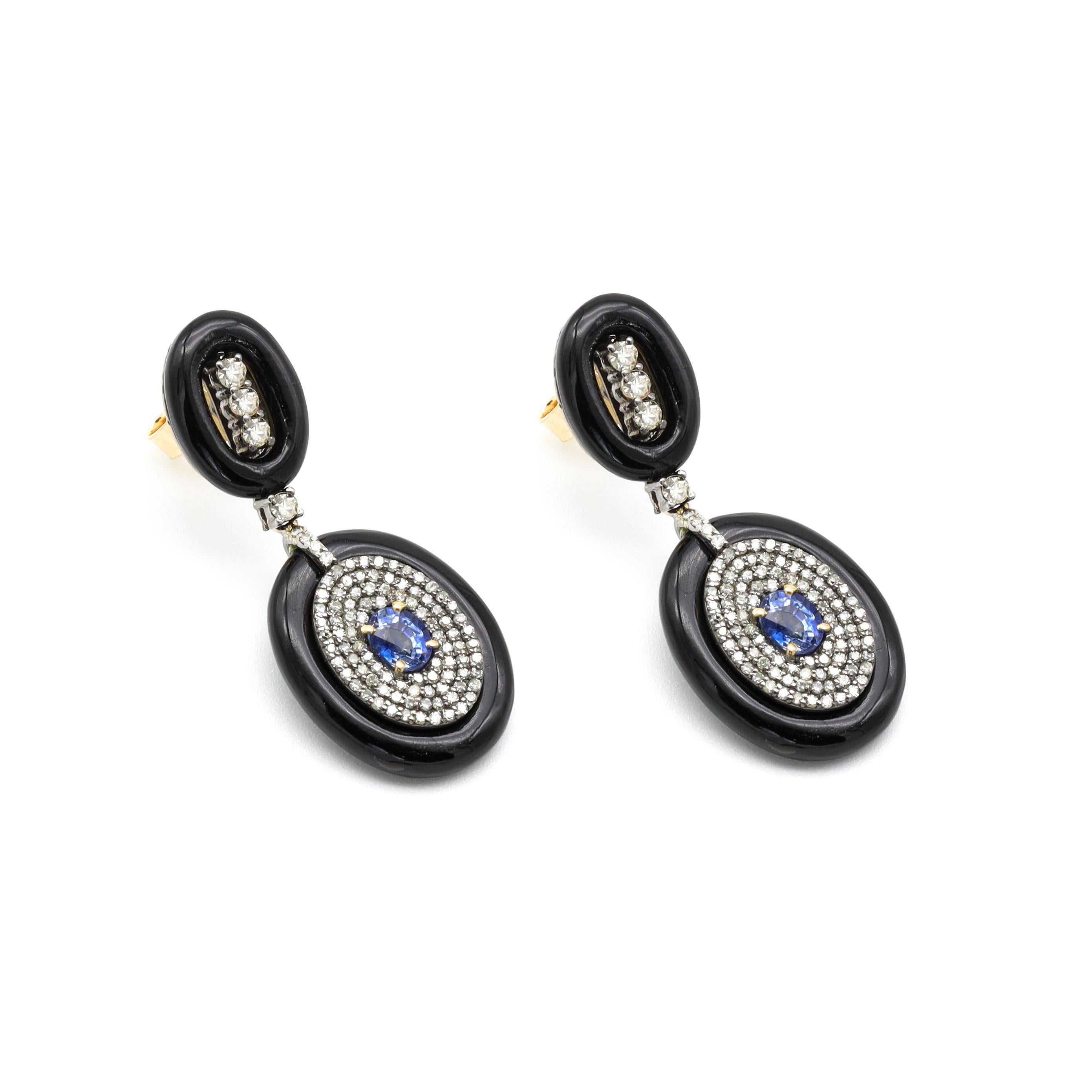 14.41 Carats Diamond, Sapphire, and Black Onyx Drop Earrings in Art-Deco Style

This art-deco style glorious black onyx, cornflower blue sapphire, and diamond earring pair is exceptional. The oval blue sapphire in the center is gracefully enclosed