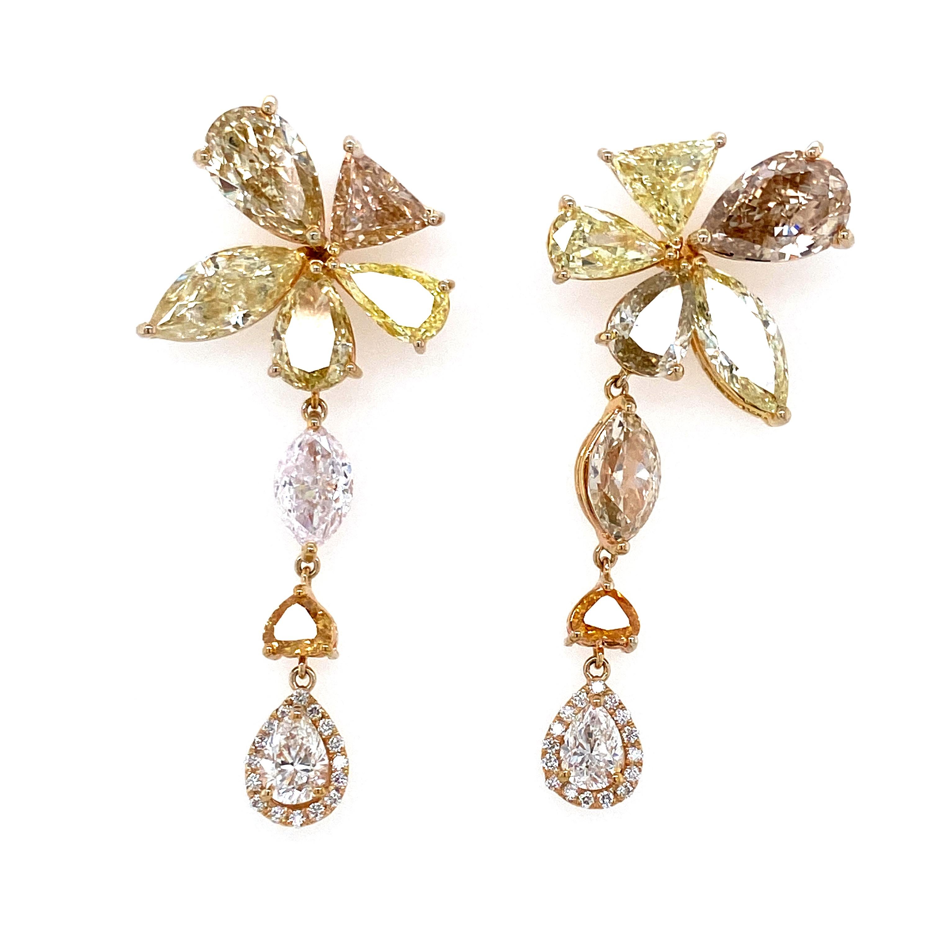 14.45 Carat Natural Fancy Coloured Diamonds And White Diamond Gold Earrings:

A magnificent pair of earrings, it features 16 fancy coloured diamonds and white diamonds in multiple cuts and shapes weighing 14.45 carat. The fancy coloured diamonds are