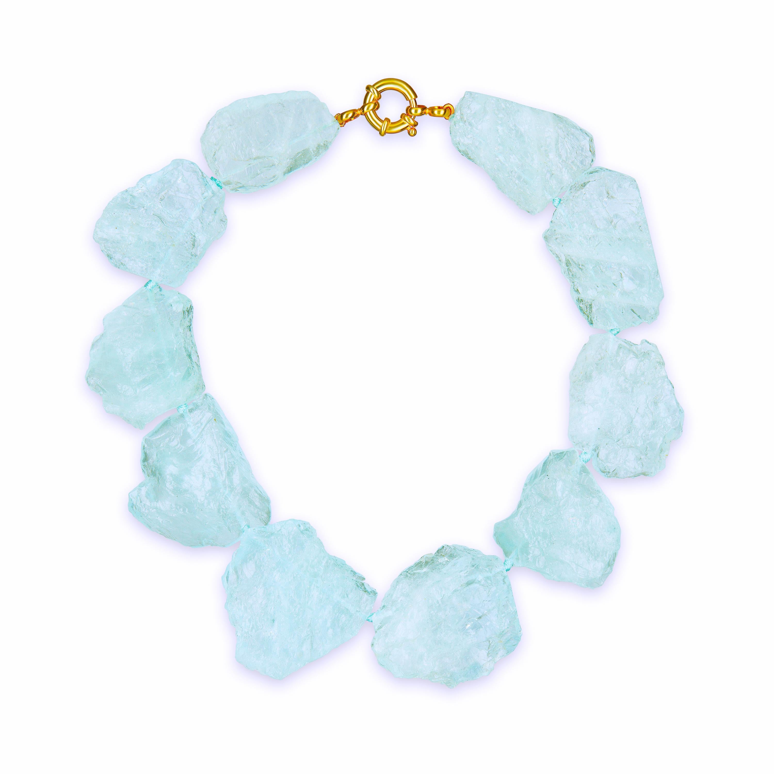1,446.50 Carats Of Carved Aquamarine Necklace Composed of 10 approximately 
2 inch Diameter Delicate Sky Blue Brazilian Aquamarines Total Length of Necklace 18 Inches. Stunningly chic and elegant. Vermeil clasp hand pale blue silk knotted.