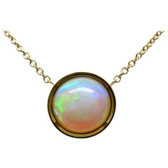 14.49 Carat Ethiopian Opal Pendant with 18 Karat Yellow Gold Chain Necklace 14.49 Carat Ethiopian Opal Pendant with 18 Karat Yellow Gold Chain Necklace