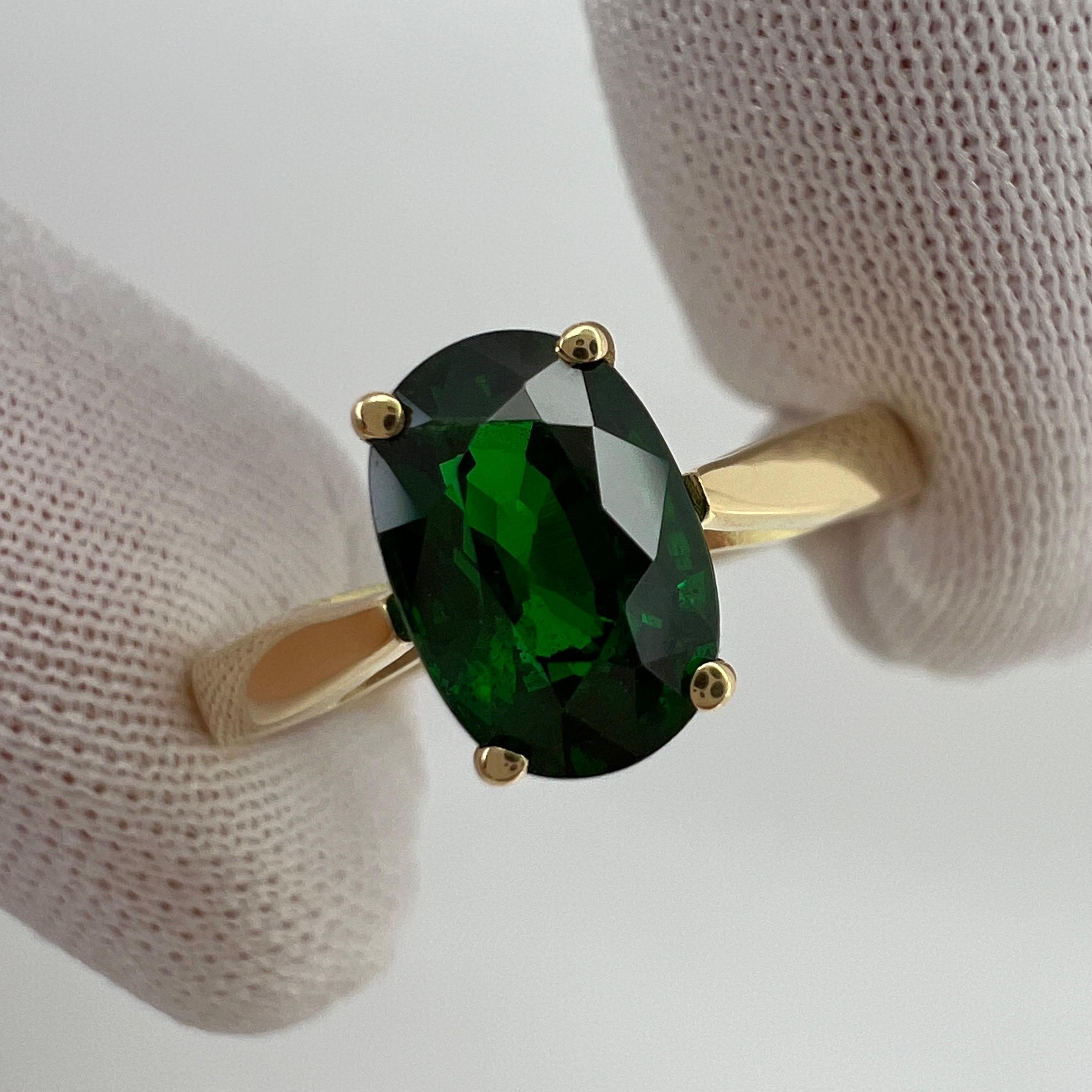 Fine Vivid Green Tsavorite Garnet 18k Yellow Gold Solitaire Ring.

Stunning 1.44 Carat tsavorite garnet with a beautiful vivid green colour and an excellent oval cut. Also has very good clarity with only some small natural inclusions visible when