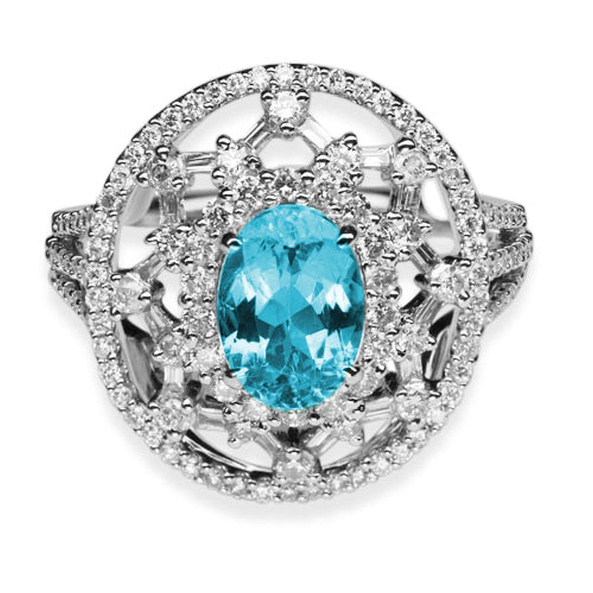 Simply Beautiful! Finely detailed Paraiba Tourmaline and Diamond Gold Cocktail Ring. Centering a Hand set securely nestled 1.45 Carat Oval Paraiba Tourmaline, surrounded by Diamonds, E/F, VS, weighing approx. 0.92tcw, including shank. Artfully Hand