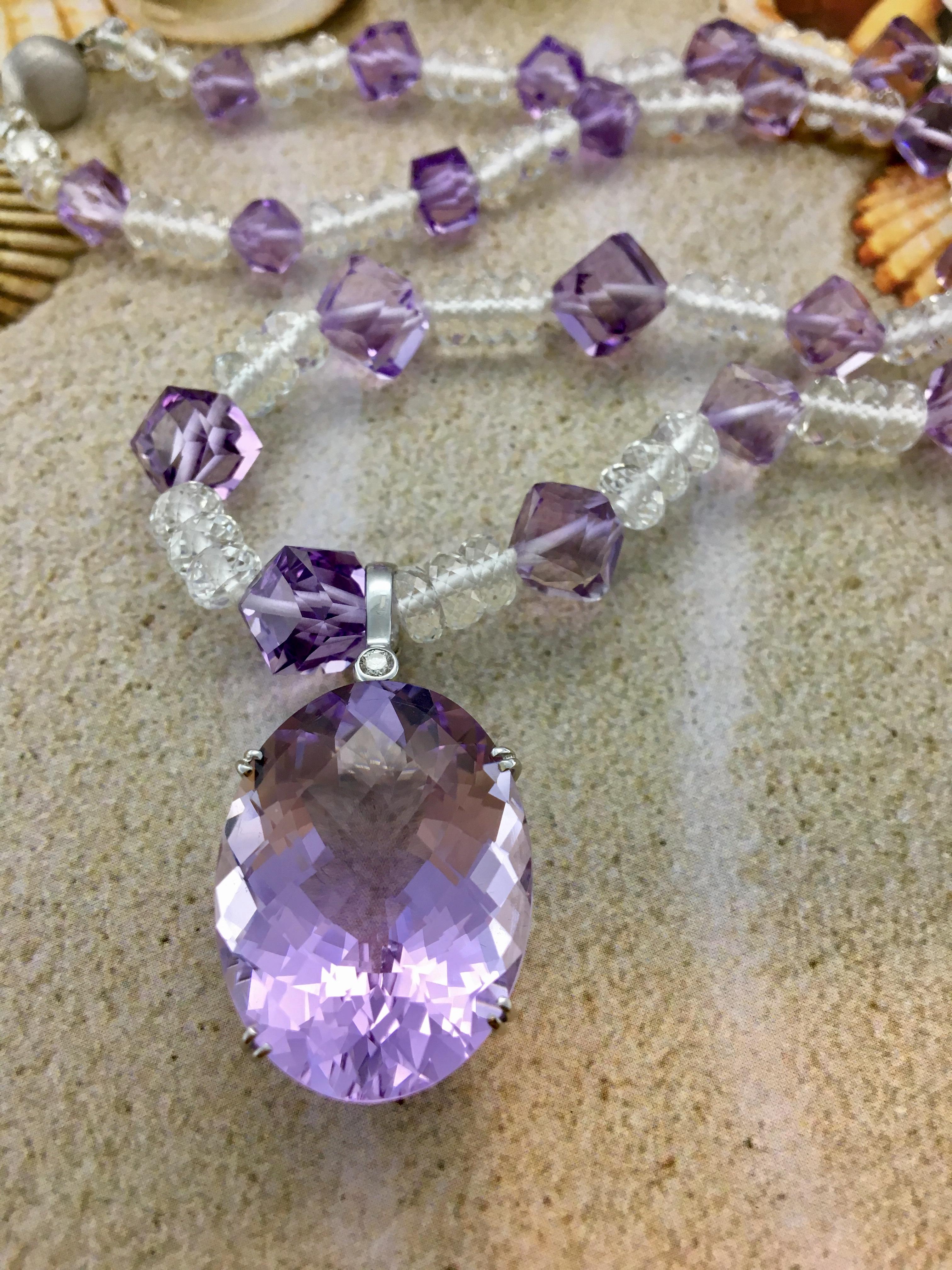 This luminous necklace is made with gorgeous cube shaped amethyst beads offset beautifully by the white topaz rondelle beads. This is a unique piece made with perfectly cut stones cut especially in a top lapidary in Germany. The total carat weight