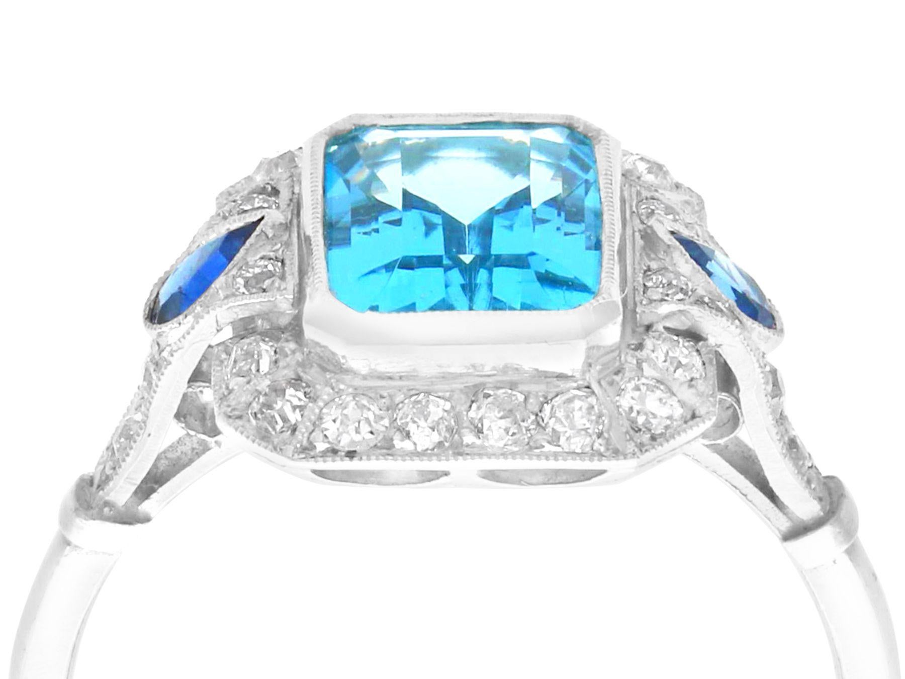 A stunning, fine and impressive 1.45 carat aquamarine, 0.14 sapphire and 0.38 carat diamond and platinum cocktail ring; part of our diverse gemstone jewelry and estate jewelry collections.

This stunning, fine and impressive aquamarine ring with