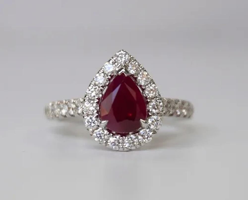 Ruby Weight: 1.45 ct, Measurements: 9x6.5 mm, Diamond Weight: 0.61 ct, Metal: 18K White Gold, Metal Weight: 5.47 gm, Ring Size: 6.5, Shape: Pear, Color: Red, Hardness: 9, Birthstone: July, Origin: Burma