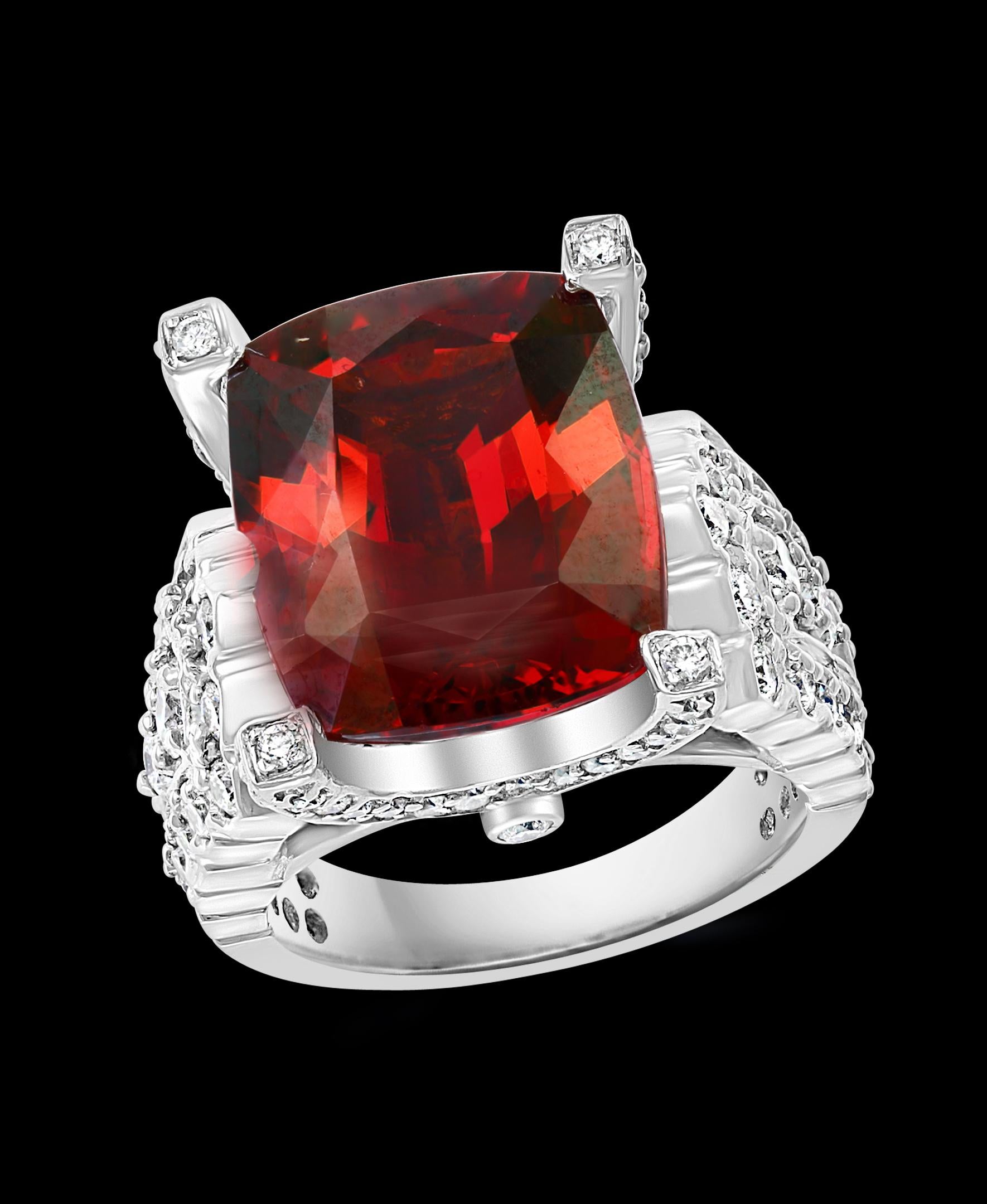  14.5 Carat Cushion Shape Rhodolite Garnet & 2 Ct Diamond Ring 18 Kt White Gold, Estate
This spectacular Ring consisting of a single Cushion l Shape  Extremely High quality Rhodolite Garnet approximately 14.5 Carat.  The  Garnet ring has