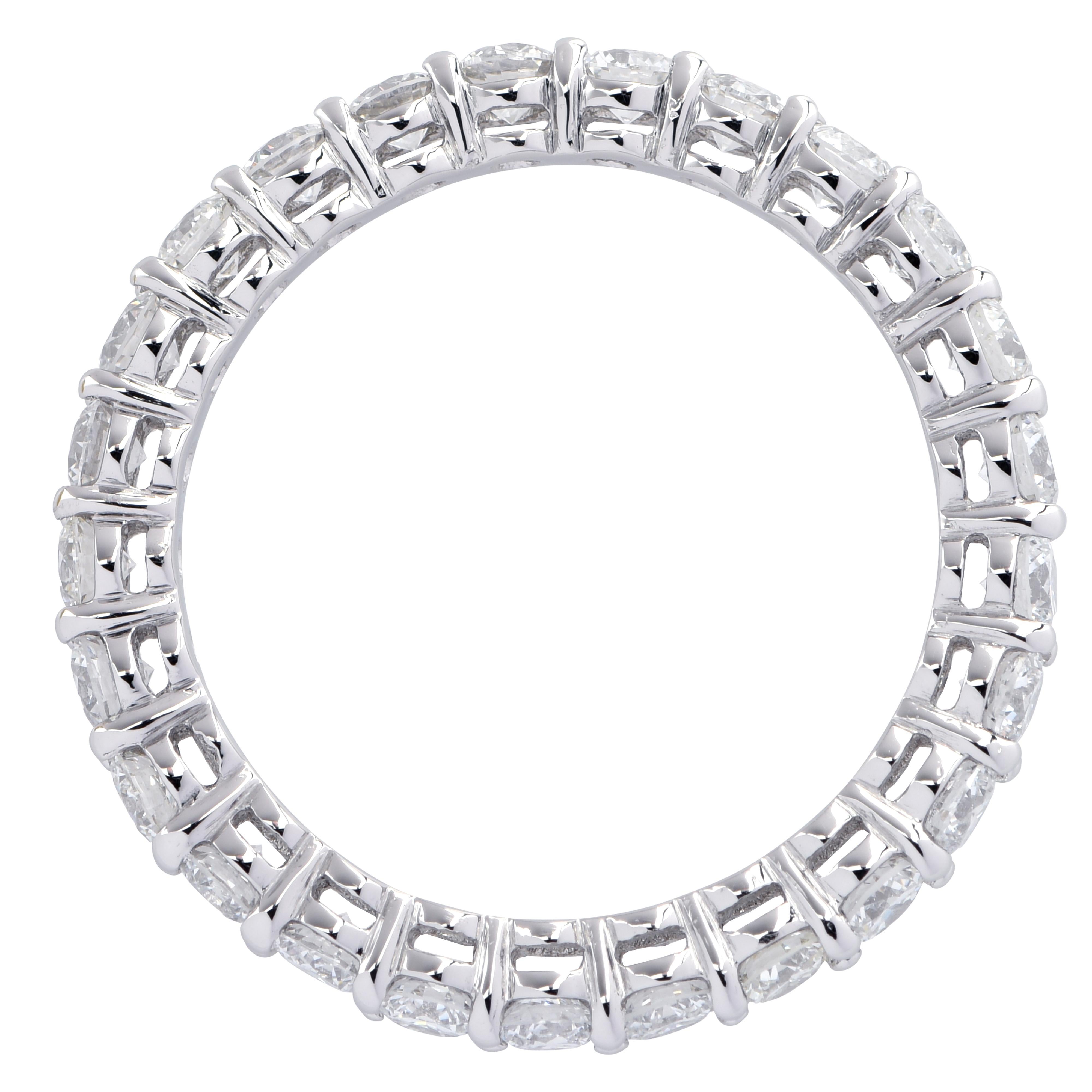 Gorgeous eternity band crafted in Platinum, showcasing 25 stunning round brilliant cut diamonds weighing 1.45 carats total, F color, VS clarity. The diamonds are set in a seamless sea of eternity, creating a spectacular symphony of brilliance and