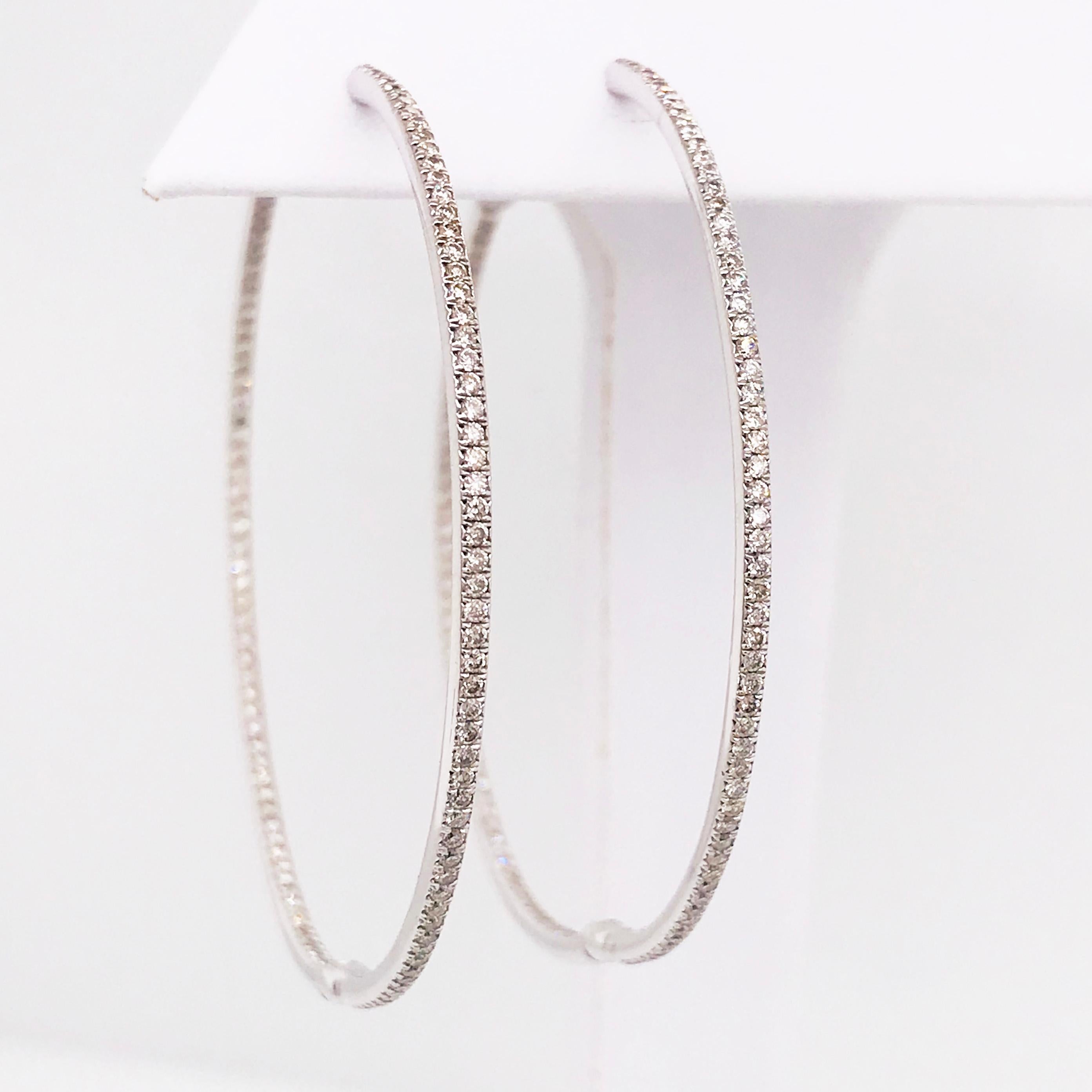 Sassy, sexy, fun and fabulous! These large diamond hoop earrings are to die for! These diamond inside out hoops are a staple in any fine jewelry collection. The 2 inch diameter is a perfect size for any occasion. They can be worn casually or for a