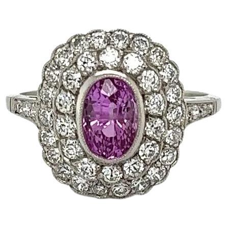 1.45 Carat Oval Pink Sapphire and OEC Diamond Vintage Platinum Double Halo Ring For Sale