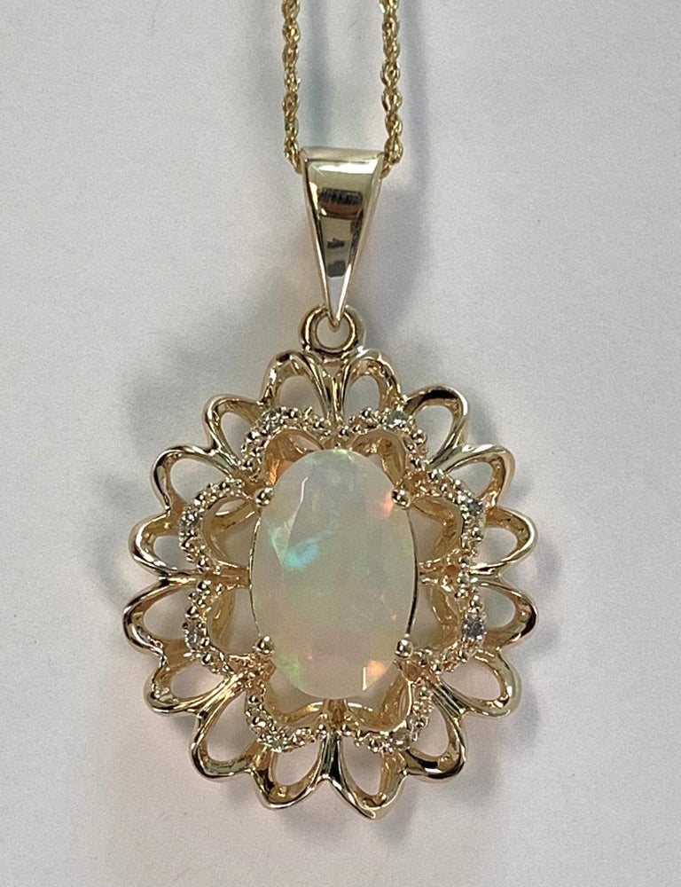 1.45 Carat Oval Shaped Opal and Diamond Pendant For Sale at 1stdibs