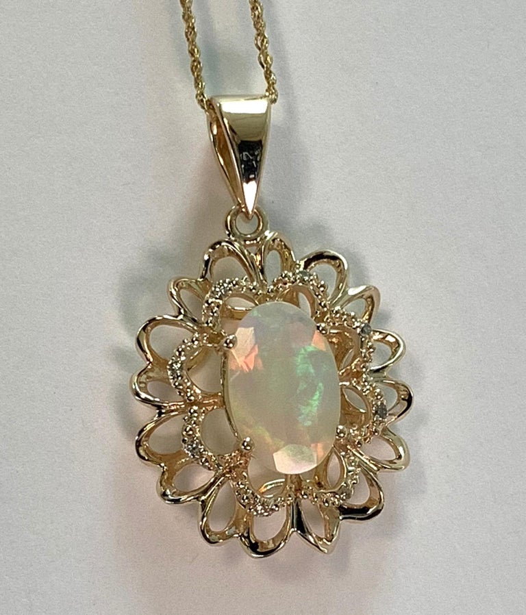 1.45 Carat Oval Shaped Opal and Diamond Pendant For Sale at 1stdibs