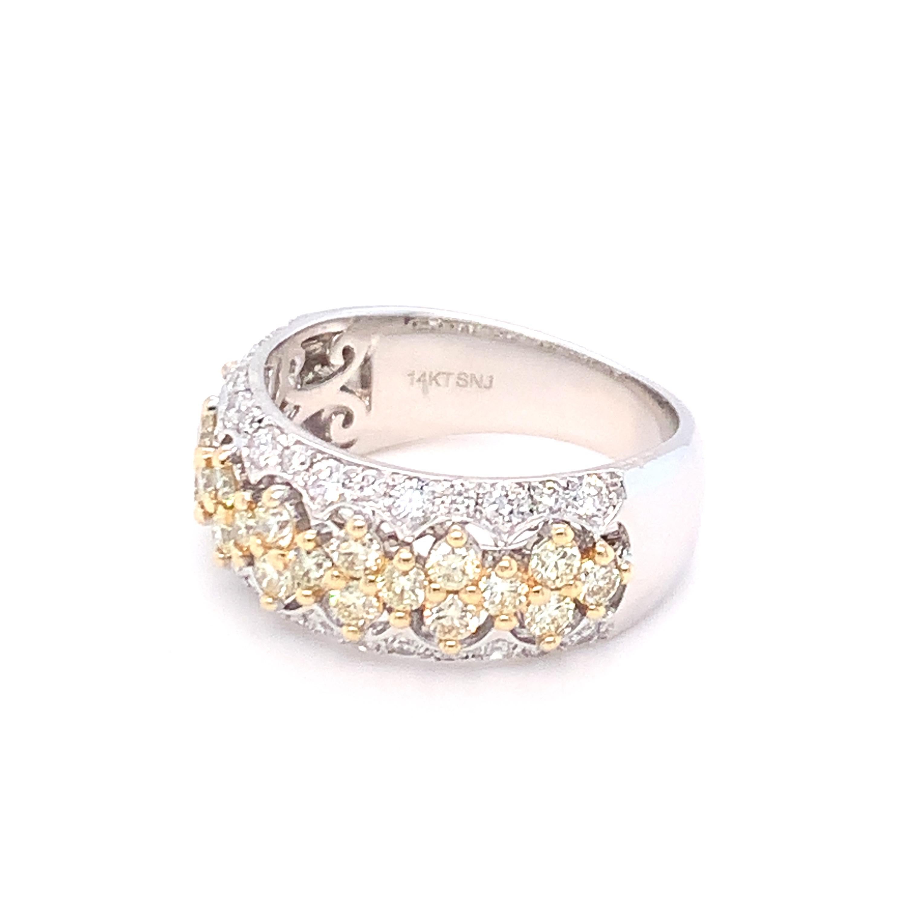 A combination of yellow diamonds sandwiched between two rows of white diamonds makes this band a stunning piece of jewelry. Set in yellow gold and finished with skilled hands.
Yellow Diamond: 0.88ct
White Diamond: 0.57ct
Gold: 14K White
Ring Size:7