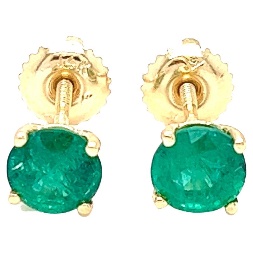 1.45 carats round Emerald Stud Earrings in 14K Yellow Gold.