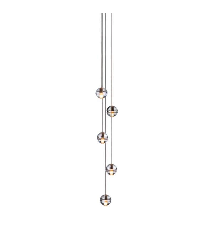14.5 Chandelier lamp by Bocci
Dimensions: Diameter 15.2 x H 300 cm 
Materials: Cast glass, blown borosilicate glass, braided metal coaxial cable, electrical components, white powder-coated canopy.
Available in Deep, Shallow, or Mini Canopy. Also