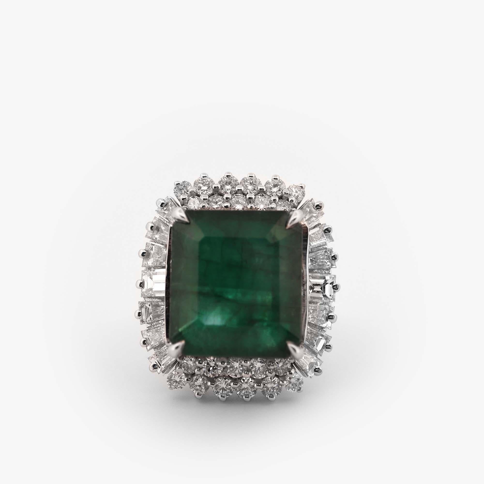 Experience the pure beauty and radiance of our exquisite 14.5 ct emerald and diamond ring, set in 14kt white gold. Crafted with the finest attention to detail, this ring is the perfect choice for anyone who appreciates the beauty and elegance of