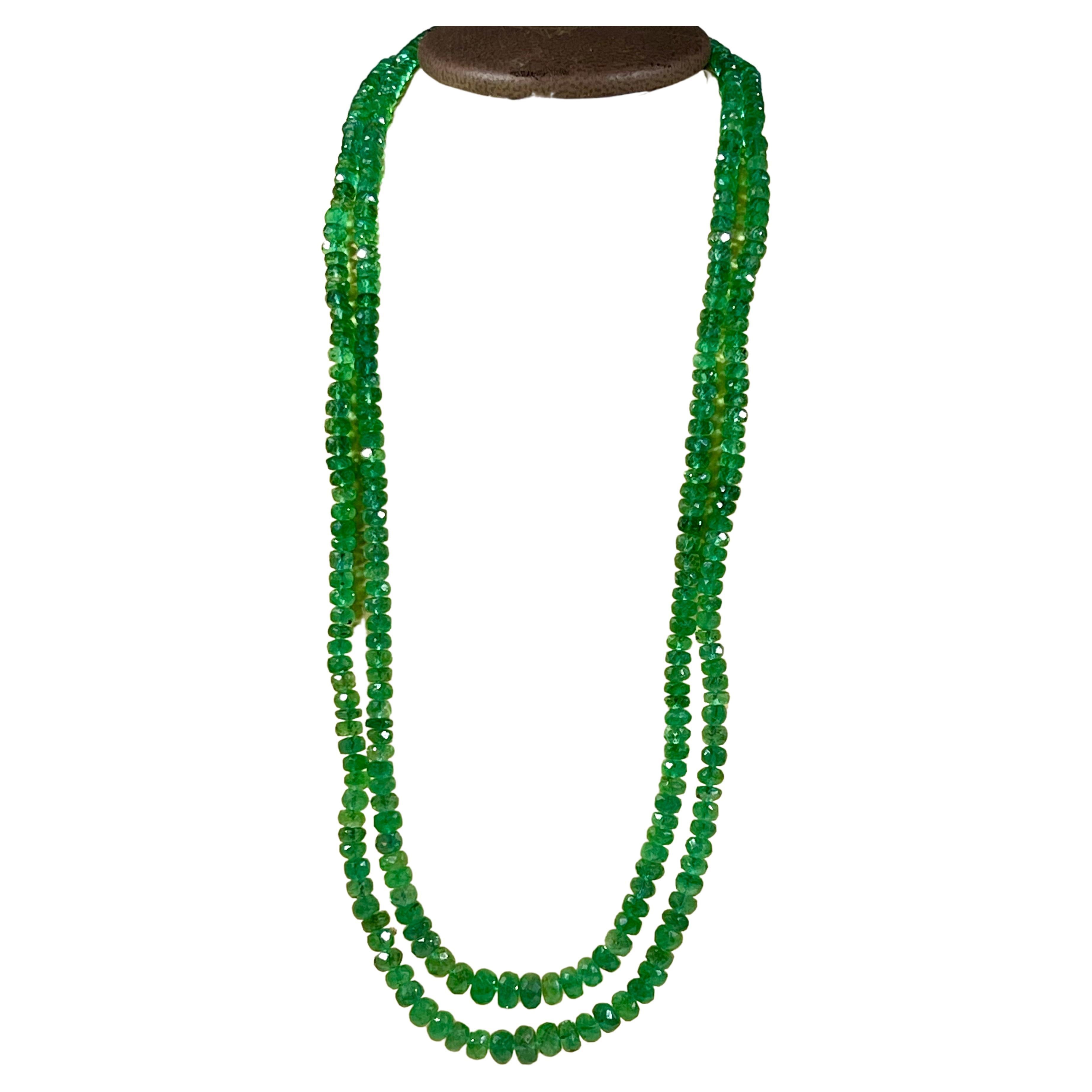 Approximately 145 ct Fine Natural Emerald Beads 2 Line Necklace with 14 Kt Yellow Gold Clasp 
This spectacular Necklace   consisting of approximately 144 Ct  of fine beads.
The shine sparkle and brilliance with deep green color is just out of this