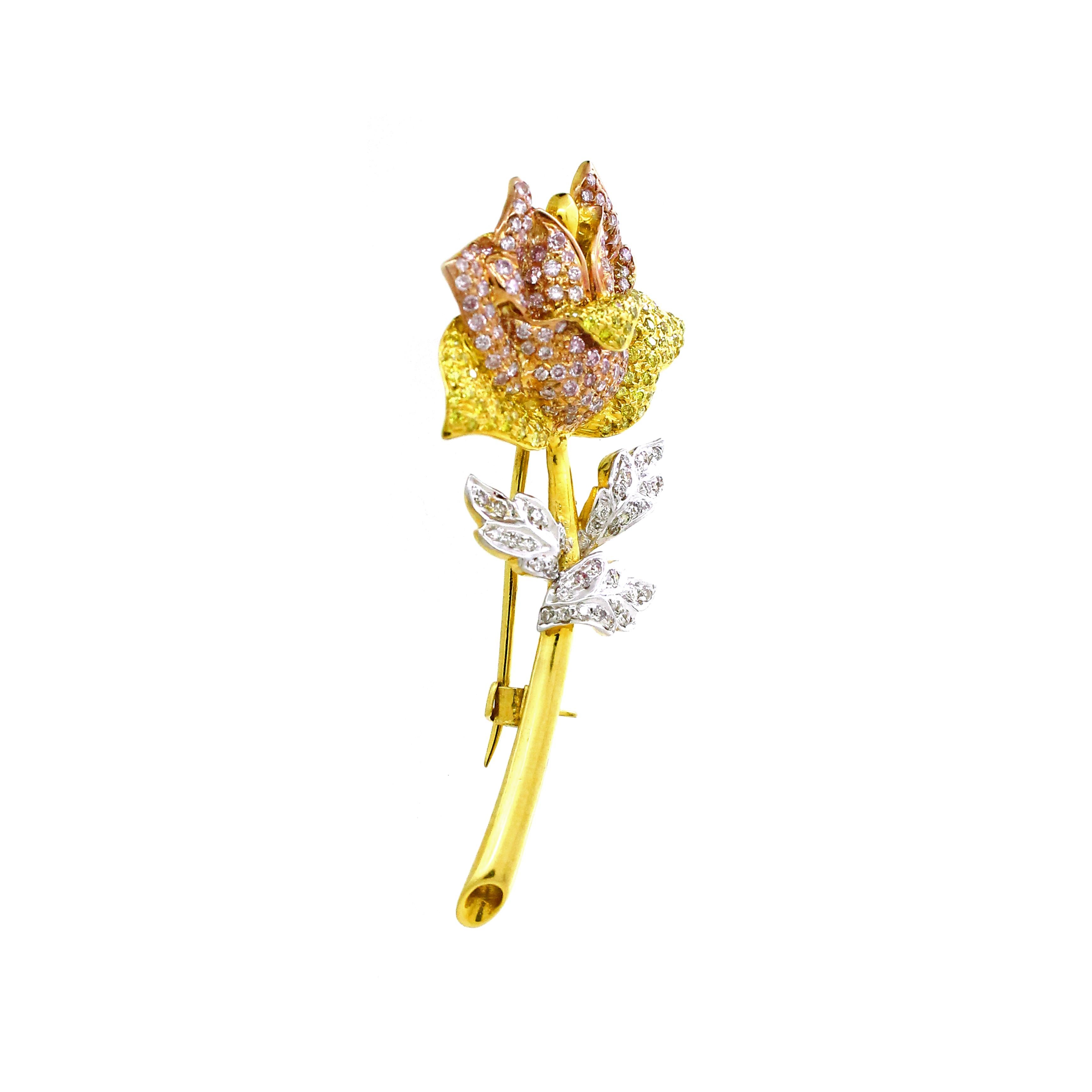 Introducing an exquisite pendant cum brooch inspired by the timeless beauty of a rose flower. This captivating piece showcases 35 white round diamonds totaling 0.23 carats, 107 pink round diamonds totaling 0.87 carats, and 66 canary round diamonds
