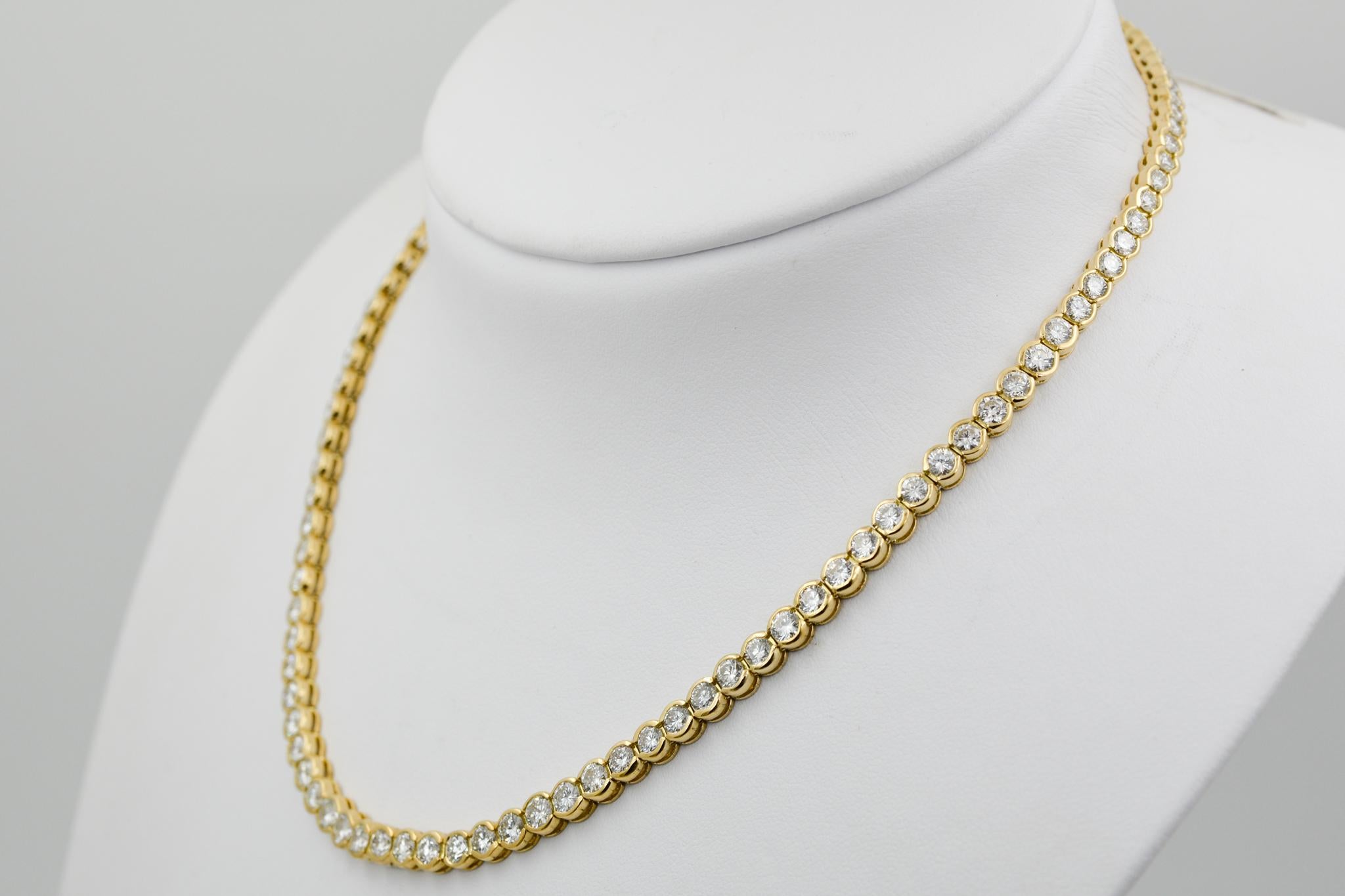 Exclusively from the Eiseman Estate Jewelry Collection, this 18k yellow gold Riviera graduated line necklace features 107 round brilliant cut diamonds (14.50ctw GH SI) 16