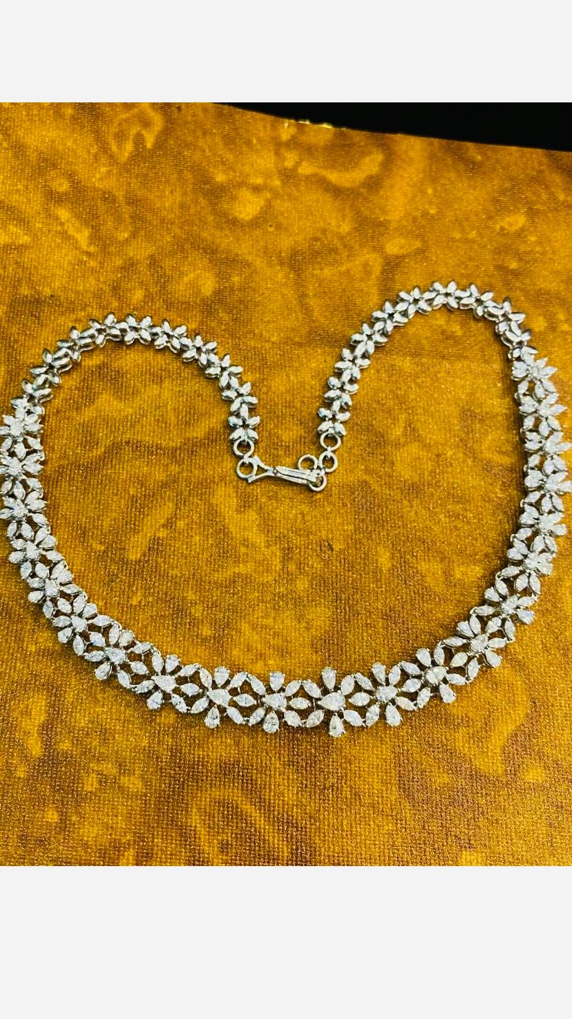 This exquisite necklace features a stunning lustrous Diamonds, creating a mesmerizing  light.
The sparkling gemstones makes this piece truly breathtaking and showstopper for any occasion.
Magnificent necklace come in 14k gold with lustrous Natural