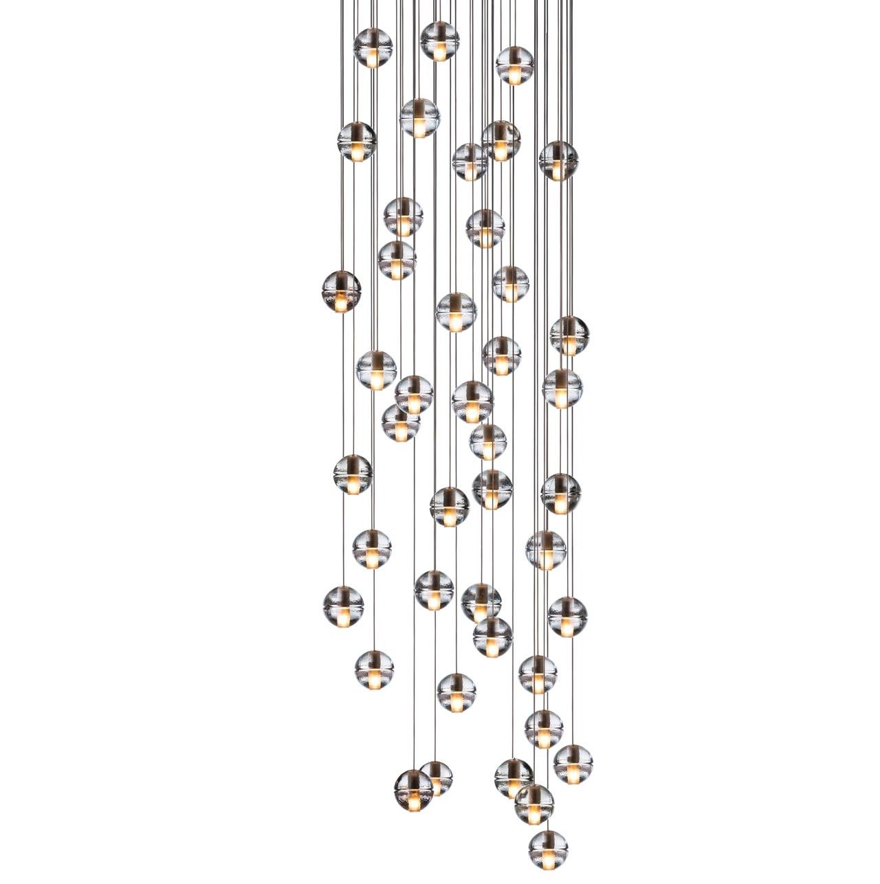 14.50 Chandelier Lamp by Bocci
Dimensions: D 75.5 x W 75.5 x H 300 cm 
Materials: Brushed Nickel, Cast glass, blown borosilicate glass, braided metal coaxial cable, electrical components, white powder-coated canopy. 
Sold individually and in