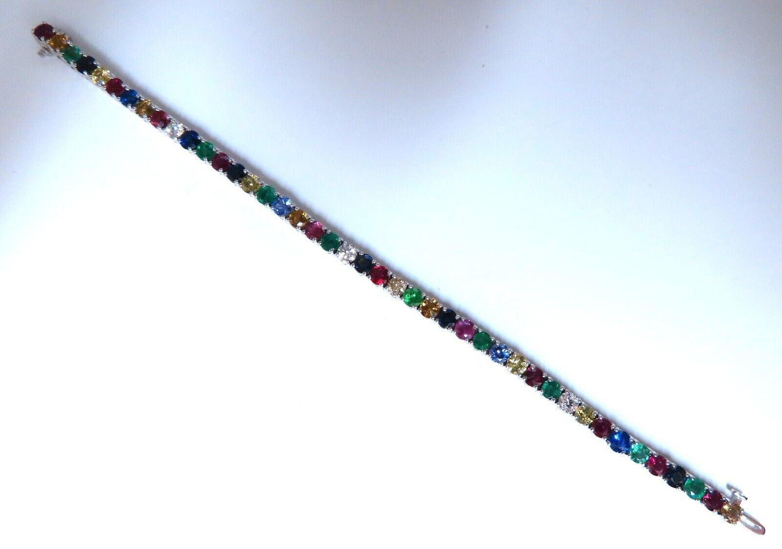 Natural Multi color Gem Line Bracelet

13.50ct Ruby, Emerald, multi-color Sapphires 

(Orange, Yellow, Blue, Violet & Pink)

Round cuts, Clean Clarity.

 1ct ROund Diamonds

H-I color Vs-2 Si-1 clarity

1 fancy light brown.

Secure pressure clasp