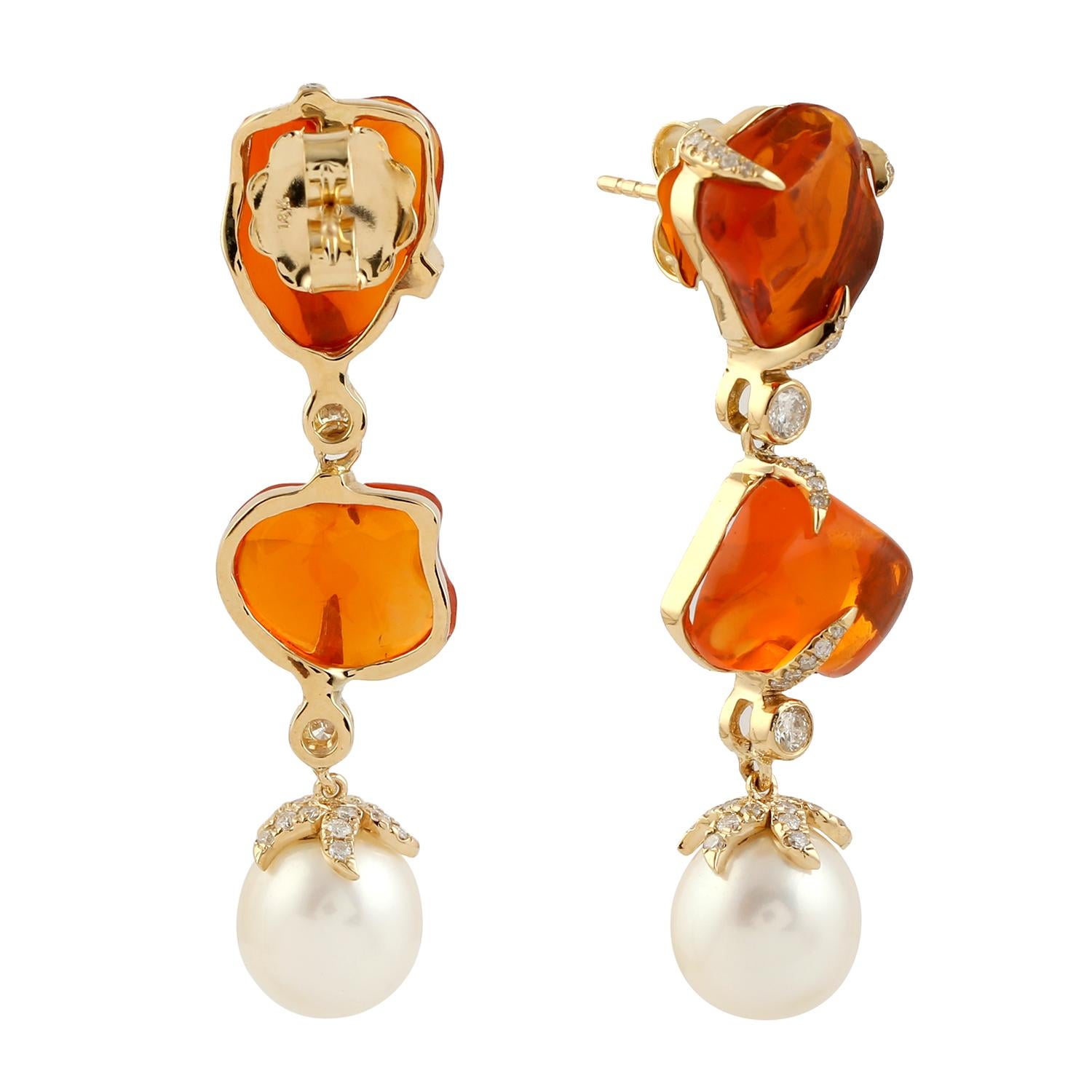 Cast in 18 karat gold. These earrings are hand set in 14.53 carats fire opal, 15.31 carats pearl, .77 carats of sparkling diamonds.

FOLLOW  MEGHNA JEWELS storefront to view the latest collection & exclusive pieces.  Meghna Jewels is proudly rated