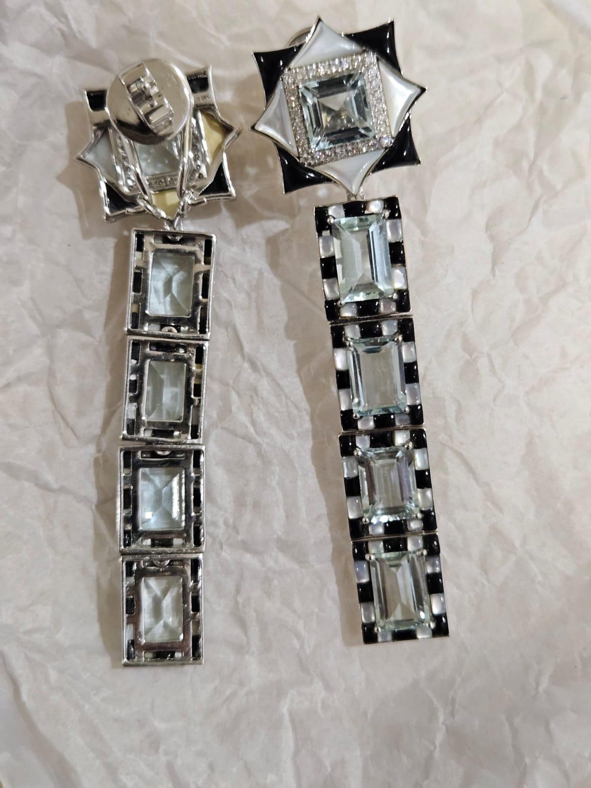 A very gorgeous and beautiful, Aquamarine, Black Onyx & Mother of Pearl Dangle Chandelier Earrings set in 18K White Gold & natural Diamonds. The weight of the Aquamarines is 14.59 carats. The combined weights of the Black Onyx and Mother of Pearl is