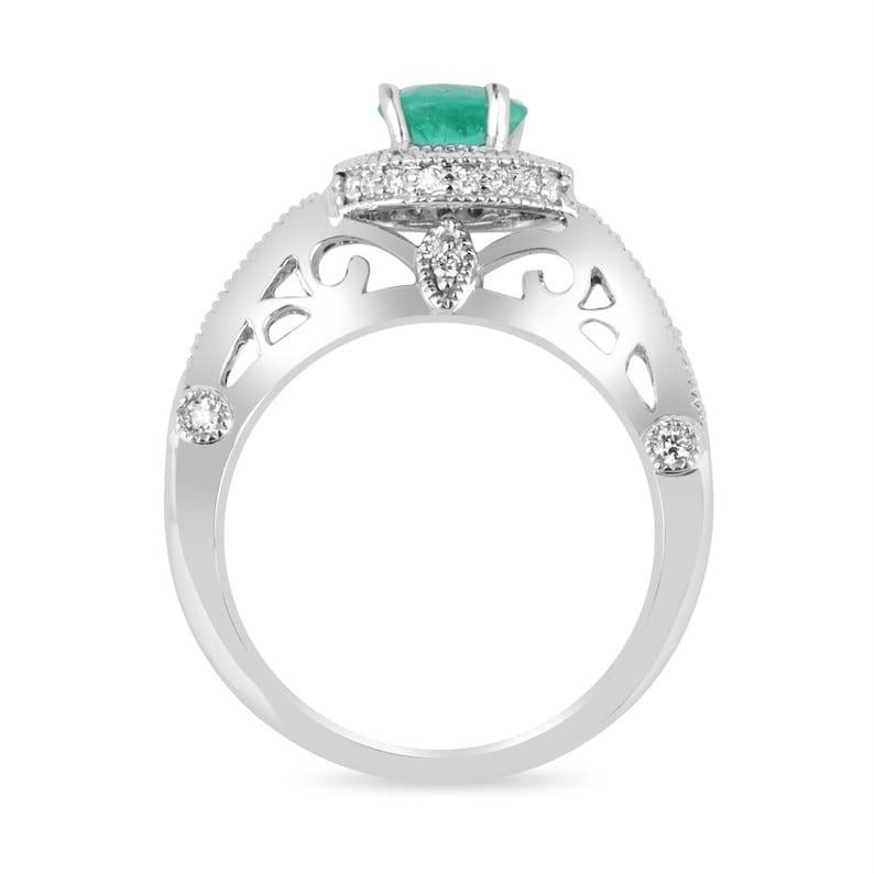 Contemporary 1.45ct Colombian Emerald & Diamond Halo Engagement Ring in 14K Gold For Sale