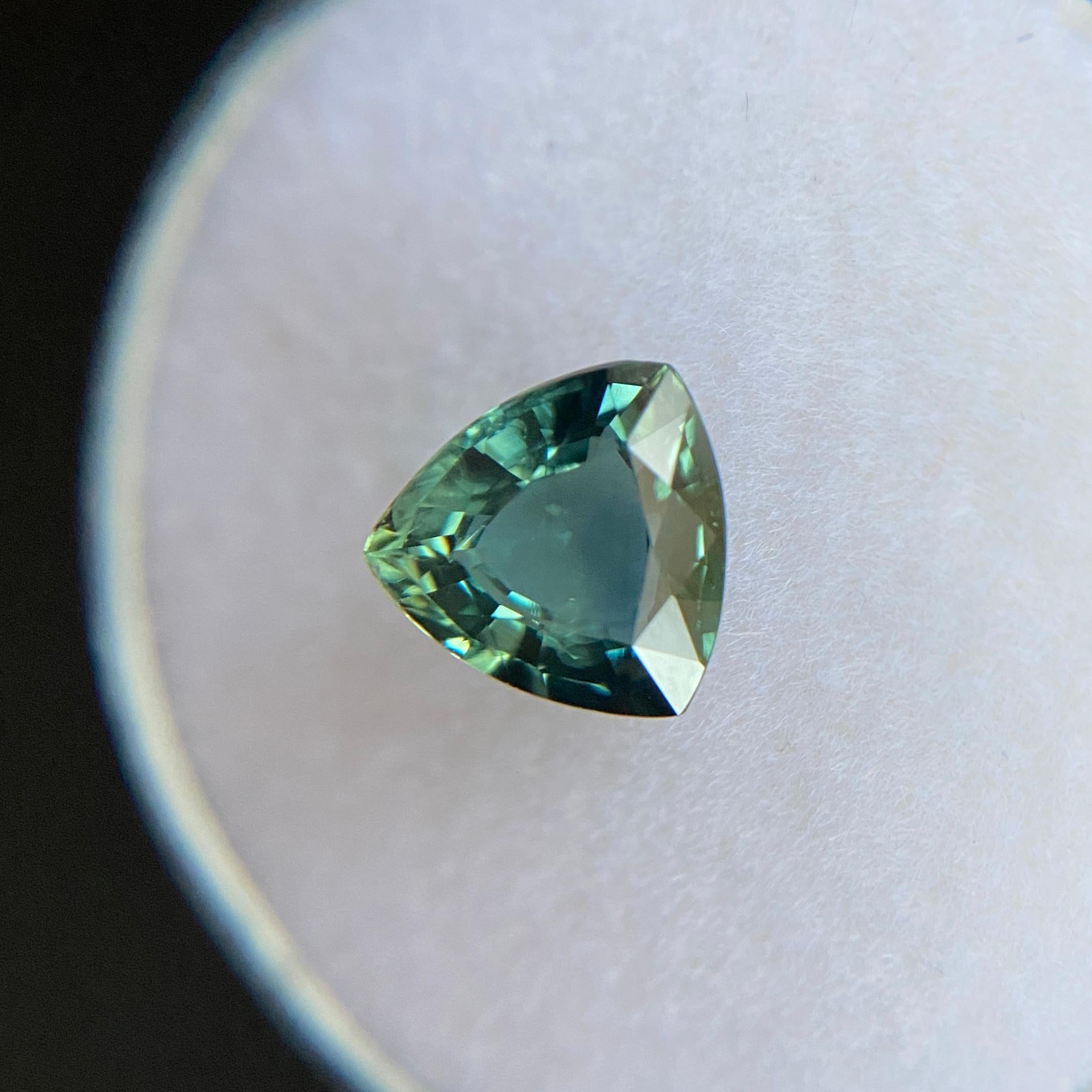 Natural Deep Green Blue Australian Sapphire Gemstone.

1.45 Carat with a beautiful greenish blue colour and very good clarity, a very clean stone.

Also has an excellent cut and polish to show great shine and colour, would look lovely in jewellery.
