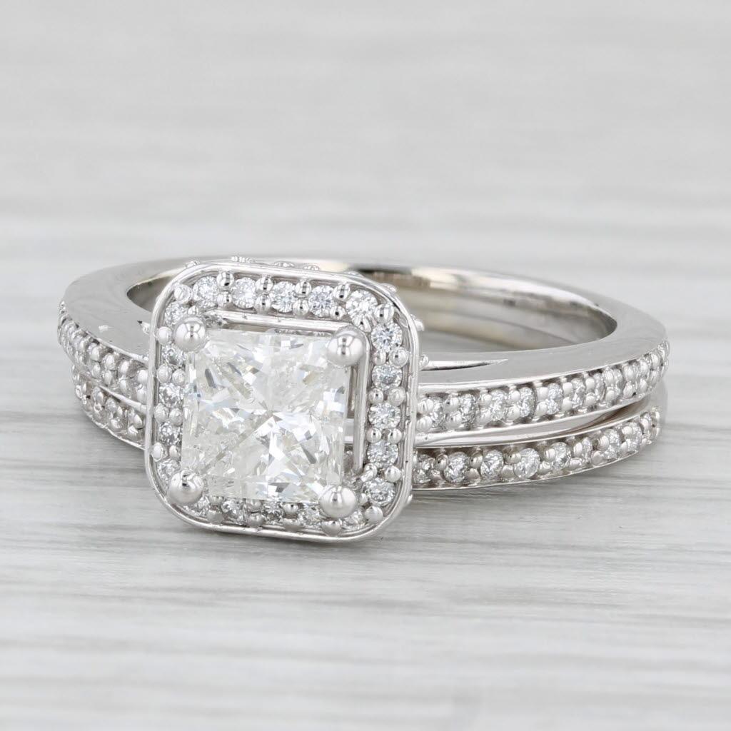 Gemstone Information: Natural Diamonds - 1.45 Total Carats
- Engagement -
Center
Carats - 1.04ct
Cut - Princess 
Color - I
Clarity - I1 

Halo
Total Carats - 0.17ctw 
Cut - Round Brilliant
Color - G - H
Clarity - VS2

Accents
Total Carats - 0.14ctw