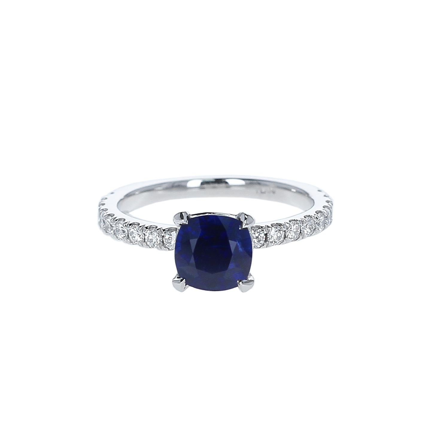 A beautiful and natural, no-heat unheated sapphire and diamond engagement ring by Gem + Honey. This jewel is centered with a 1.46-carat cushion-shaped blue sapphire from Burma (Myanmar), accented with eighteen round brilliant-cut natural,