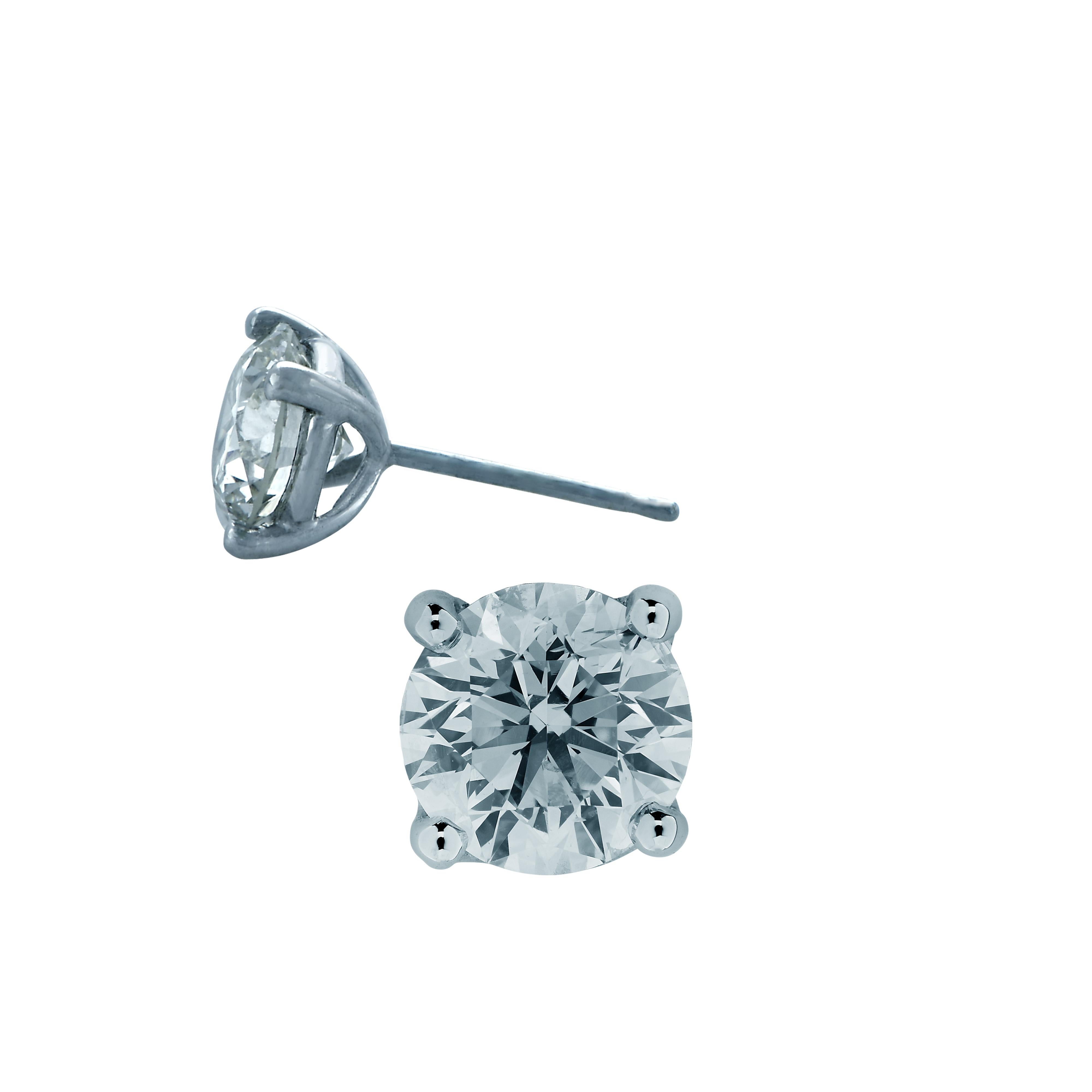 Stunning solitaire stud earrings crafted in 18 karat white gold, showcasing 2 round brilliant cut diamonds weighing 1.46 carats total, F color SI clarity. These gorgeous earrings are classic and timelessly elegant.

Our pieces are all accompanied by