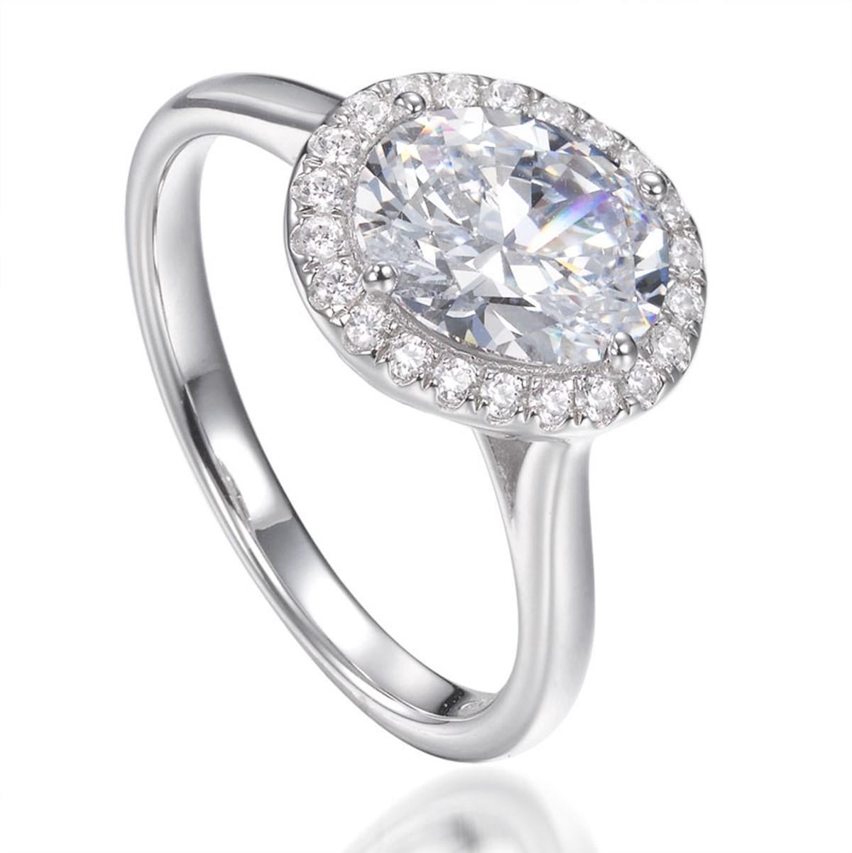 The contemporary nature of this highly intriguing ring captures the most unusual of designs.

Featuring a slightly off-set oval cubic zirconia measuring 1.46ct, surrounded by twenty-two of the highest quality micro set round brilliant cut cubic